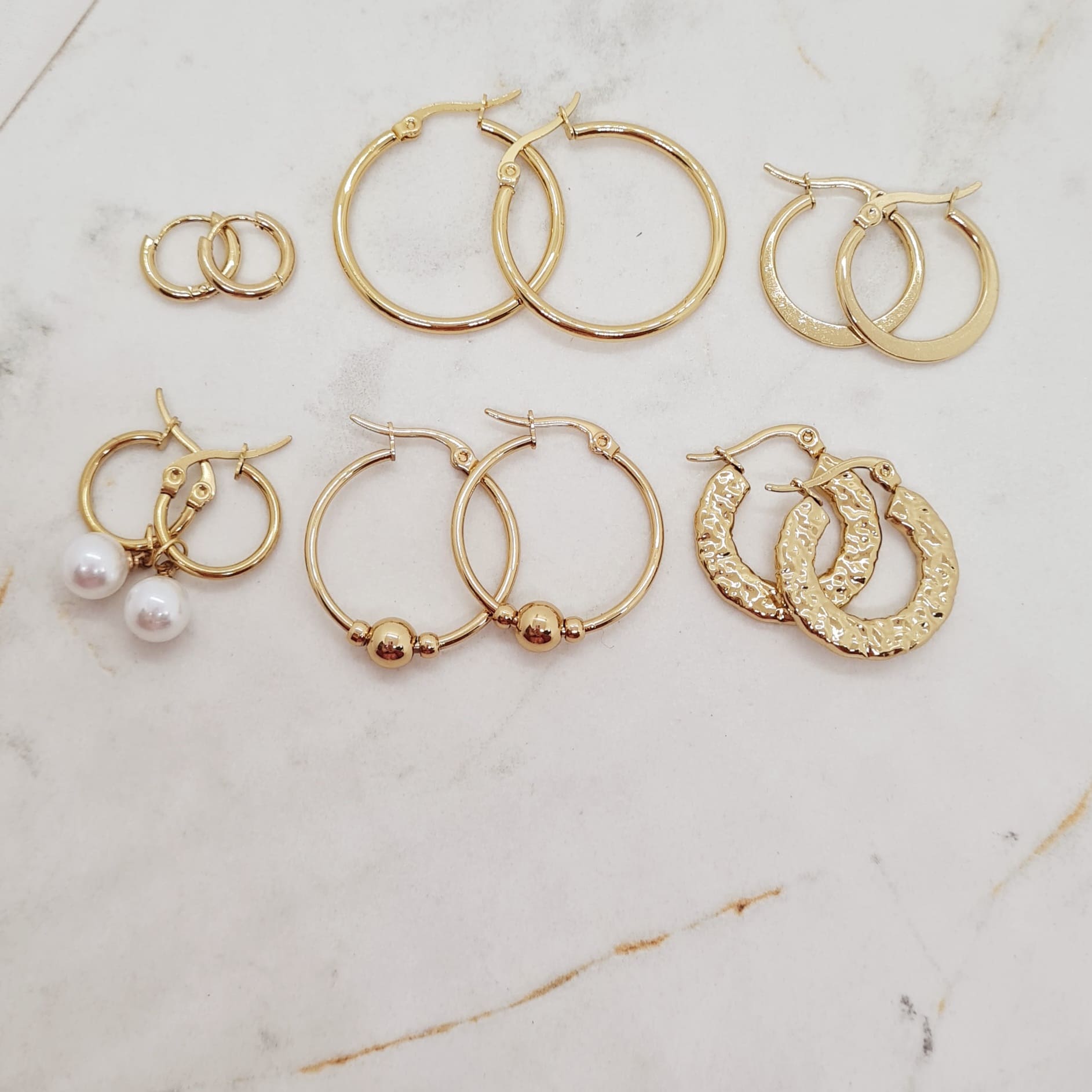 Imagen de producto COMBO DE ARGOLLAS DE ACERO DORADO