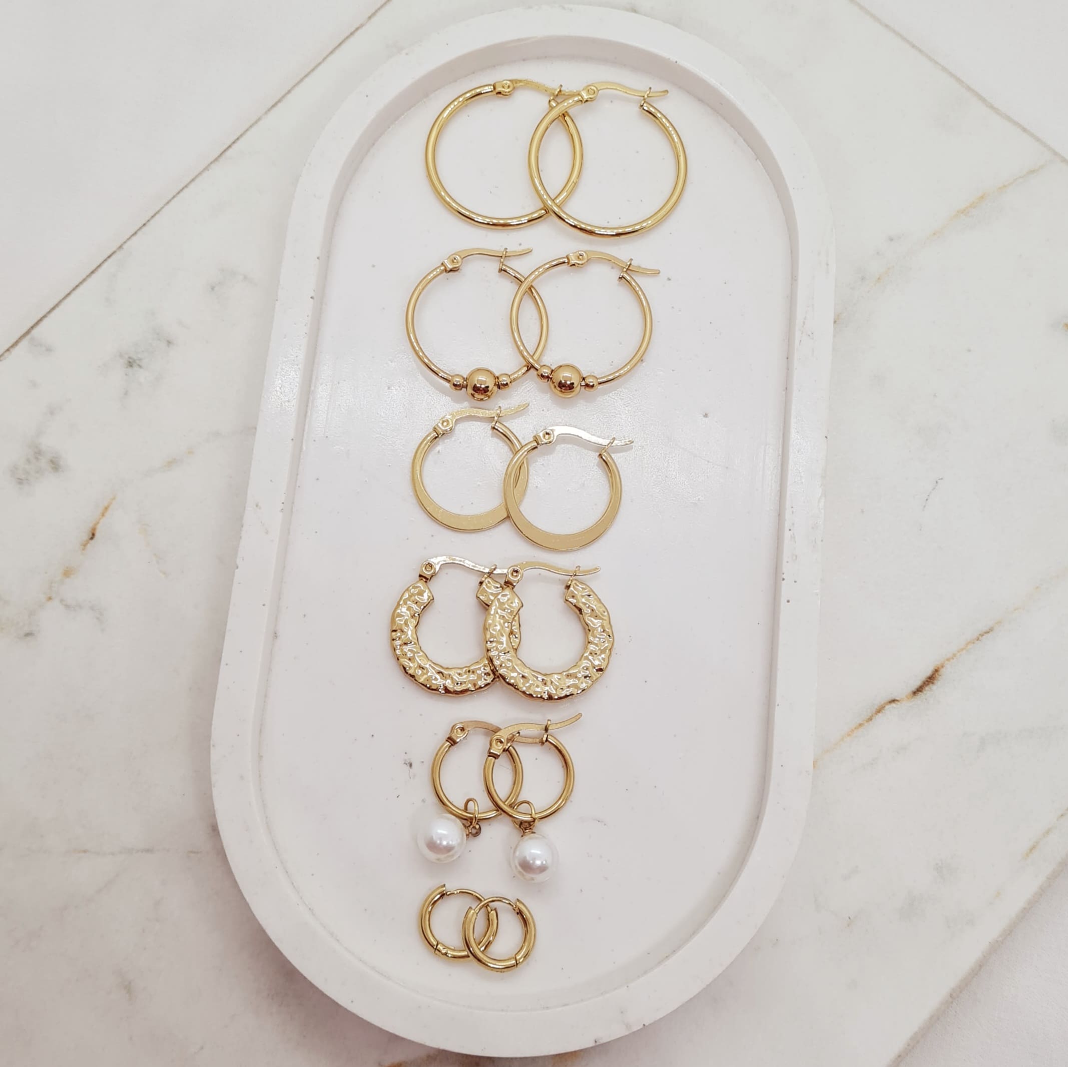 Imagen de producto COMBO DE ARGOLLAS DE ACERO DORADO