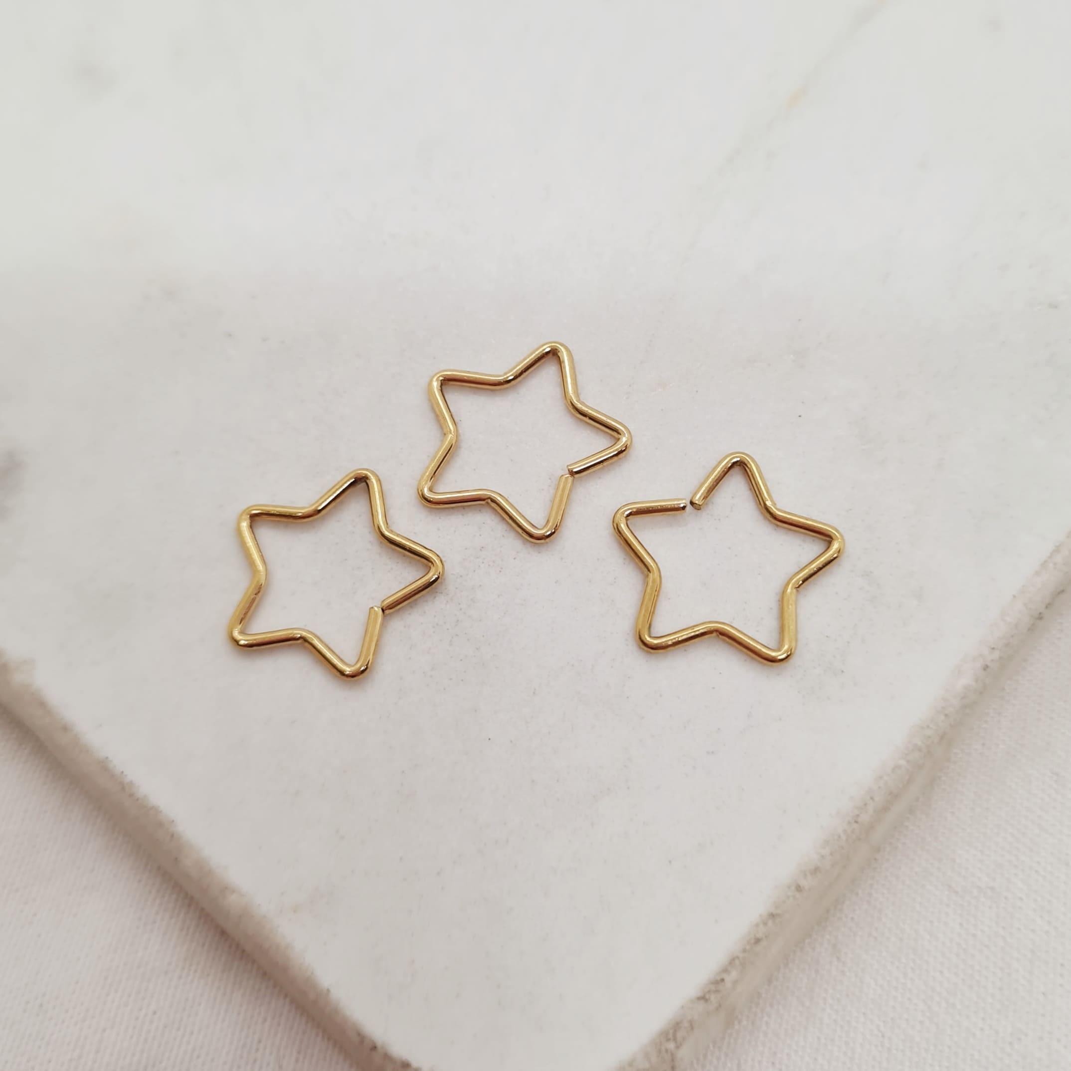 Imagen de producto PIERCING ESTRELLA DORADA - PACK X3 UNIDADES