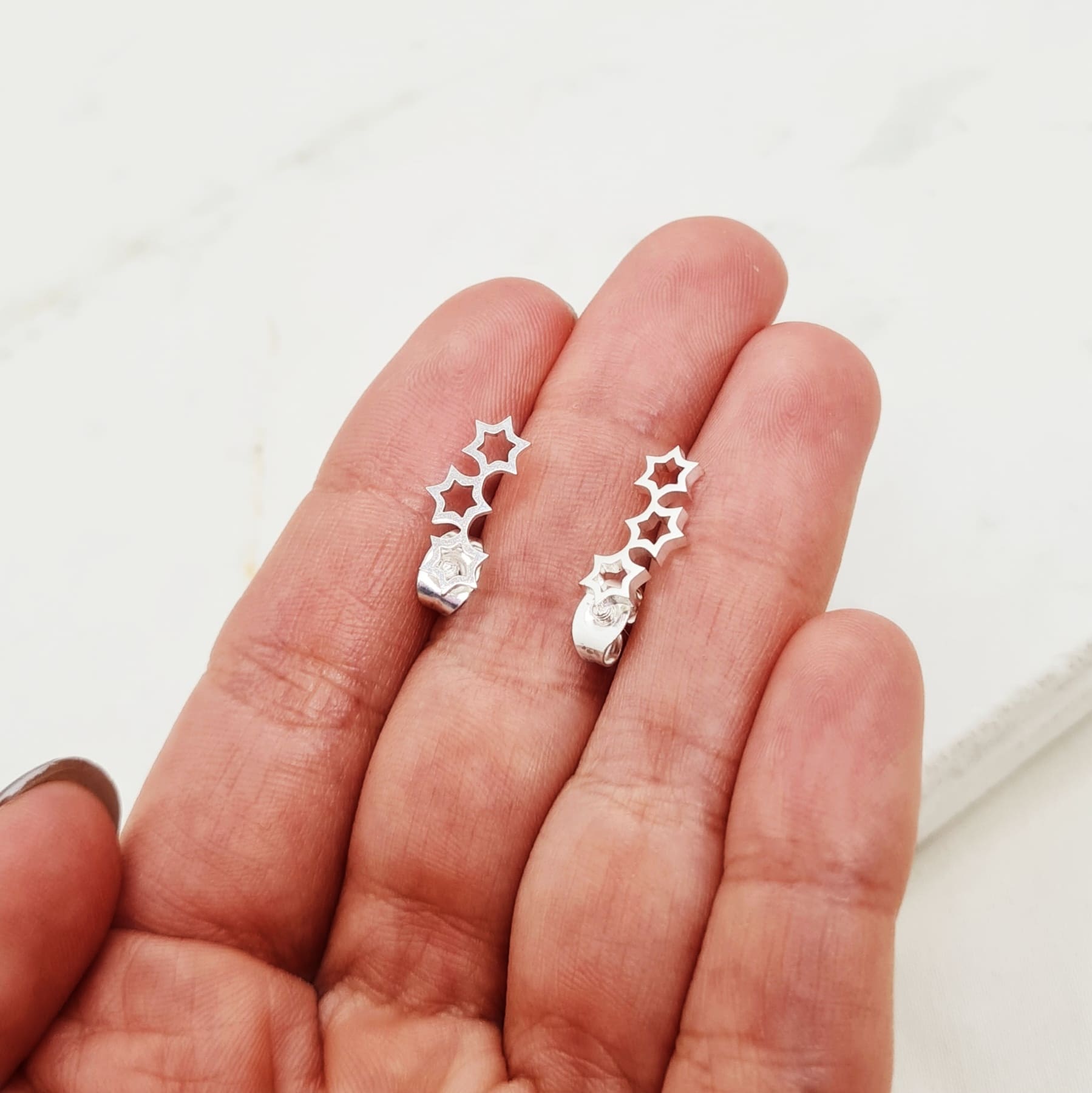 Imagen de producto AROS ACERO BLANCO GRANDE - ESTRELLAS CALADAS