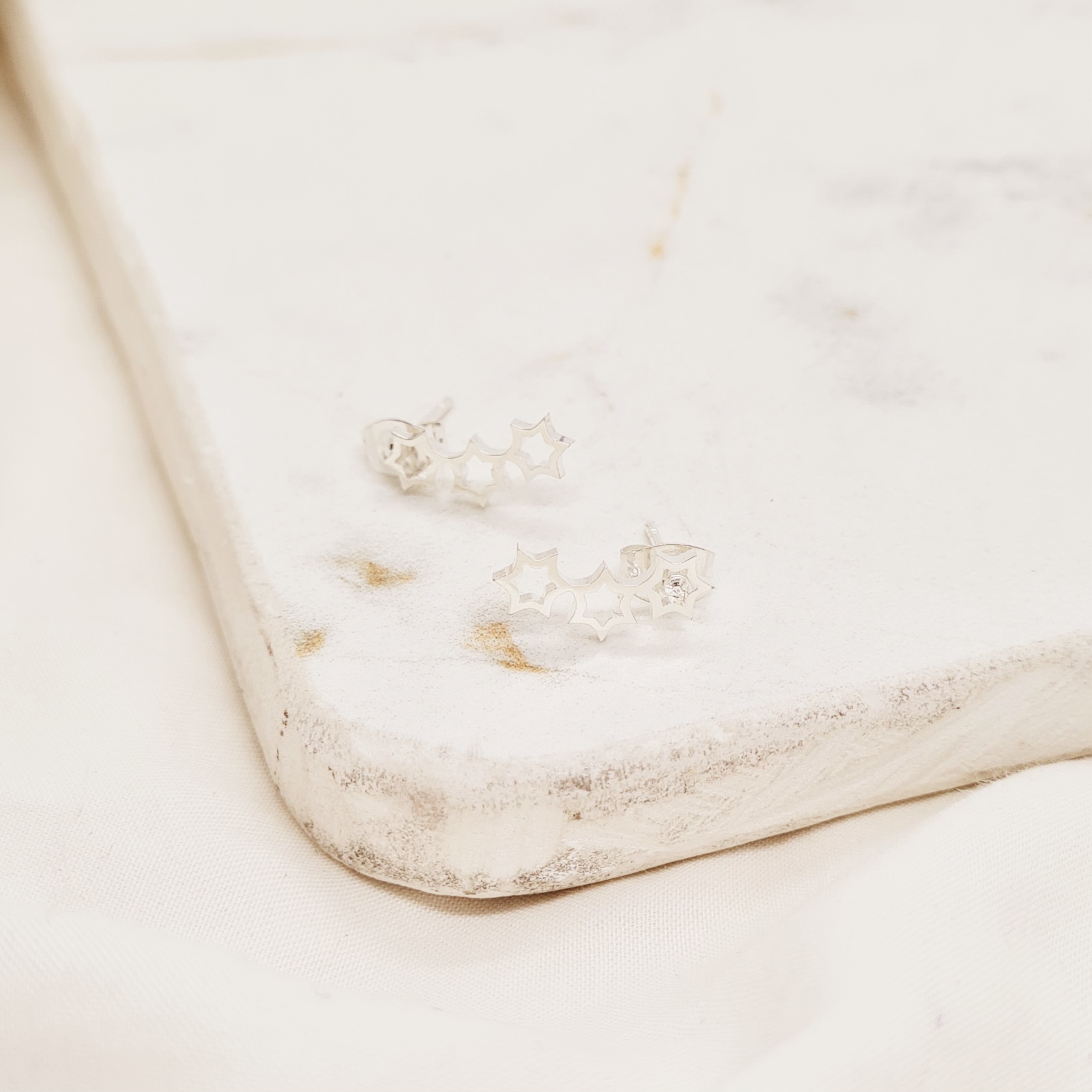 Imagen de producto AROS ACERO BLANCO GRANDE - ESTRELLAS CALADAS