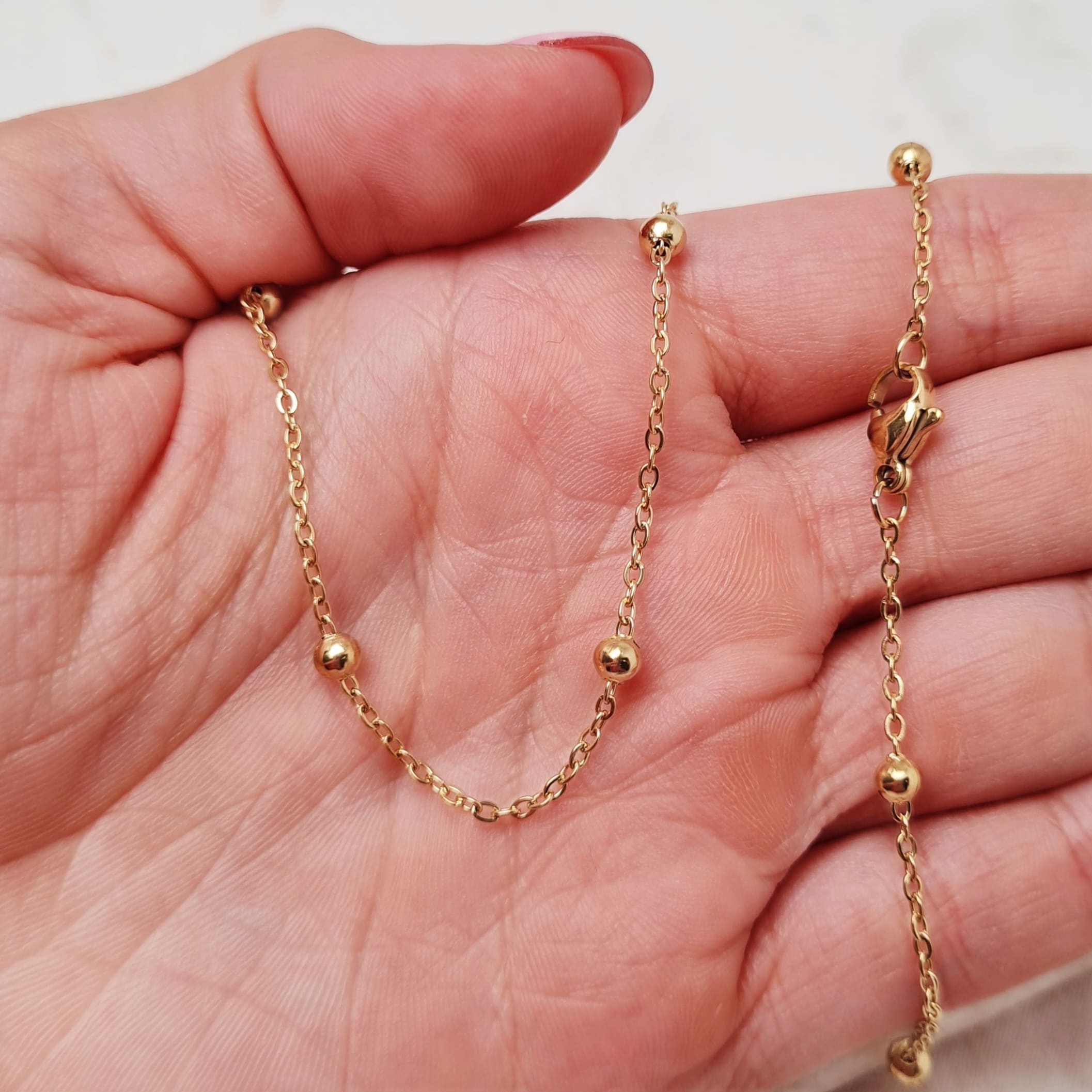 Imagen de producto CADENA ACERO DORADO FINA CON BOLITAS GRANDES