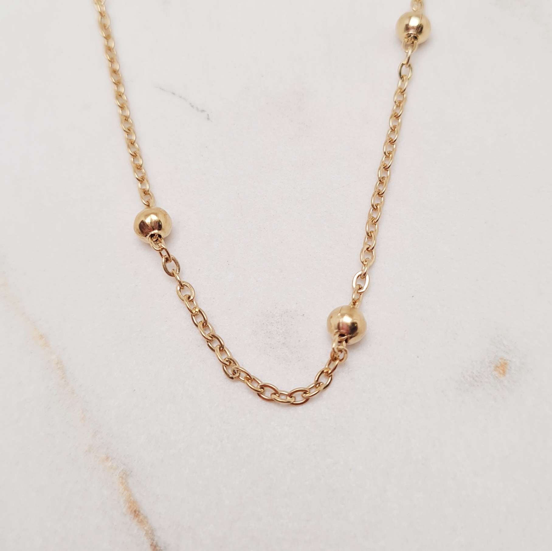 Imagen de producto CADENA ACERO DORADO FINA CON BOLITAS GRANDES