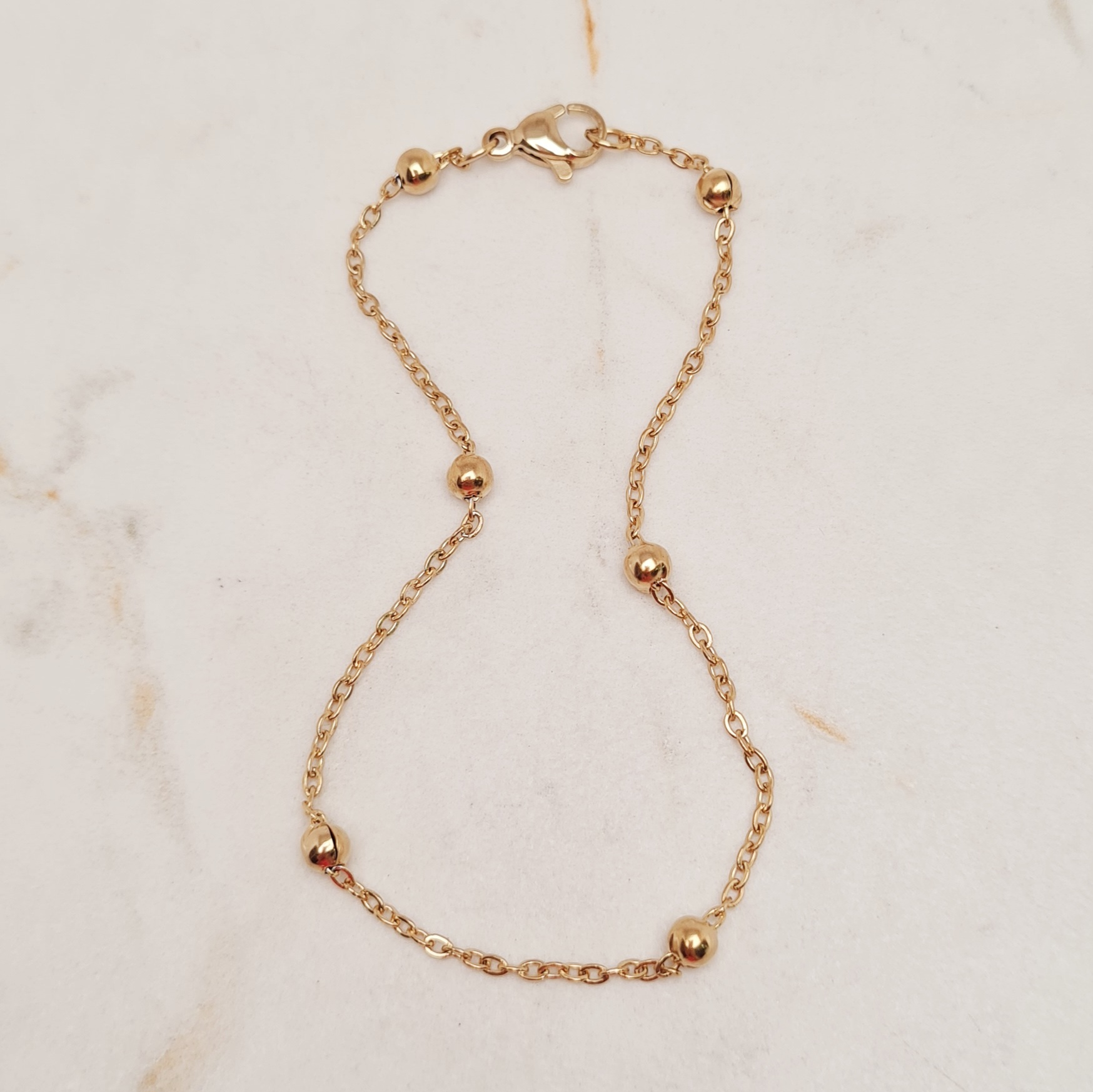 Imagen de producto PULSERA ACERO DORADO FINA CON BOLITAS GRANDES