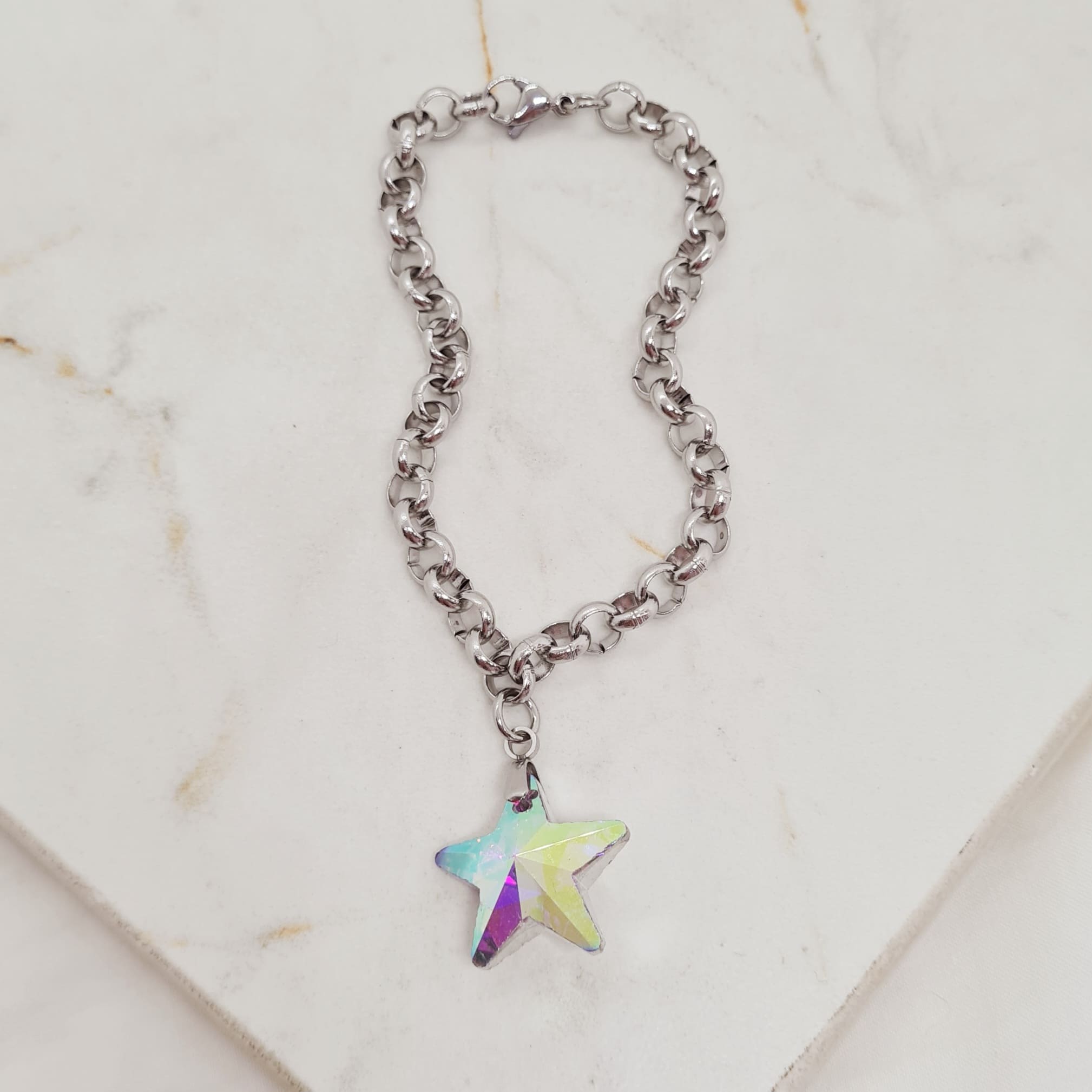 Imagen de producto PULSERA CON DIJE CRISTAL - ESTRELLA TORNASOL CLARO OPACO