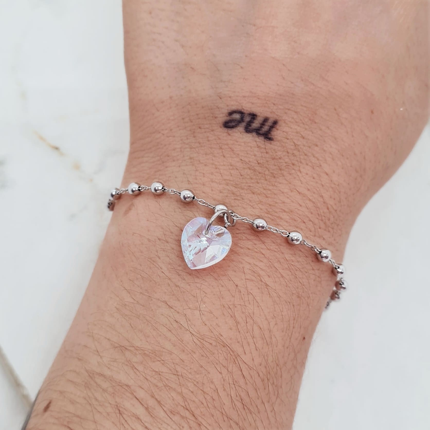 Imagen de producto PULSERA CON BOLITAS Y CRISTAL CORAZON CHICO - TORNASOL CLARO