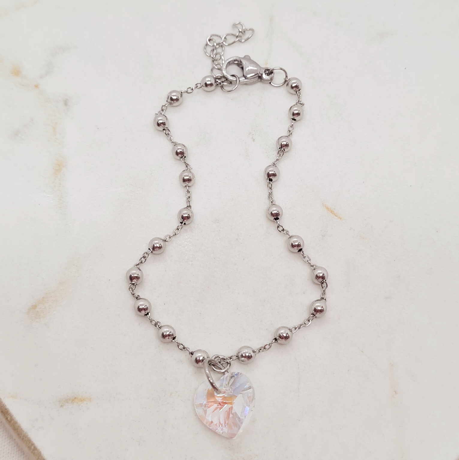 Imagen de producto PULSERA CON BOLITAS Y CRISTAL CORAZON CHICO - TORNASOL CLARO
