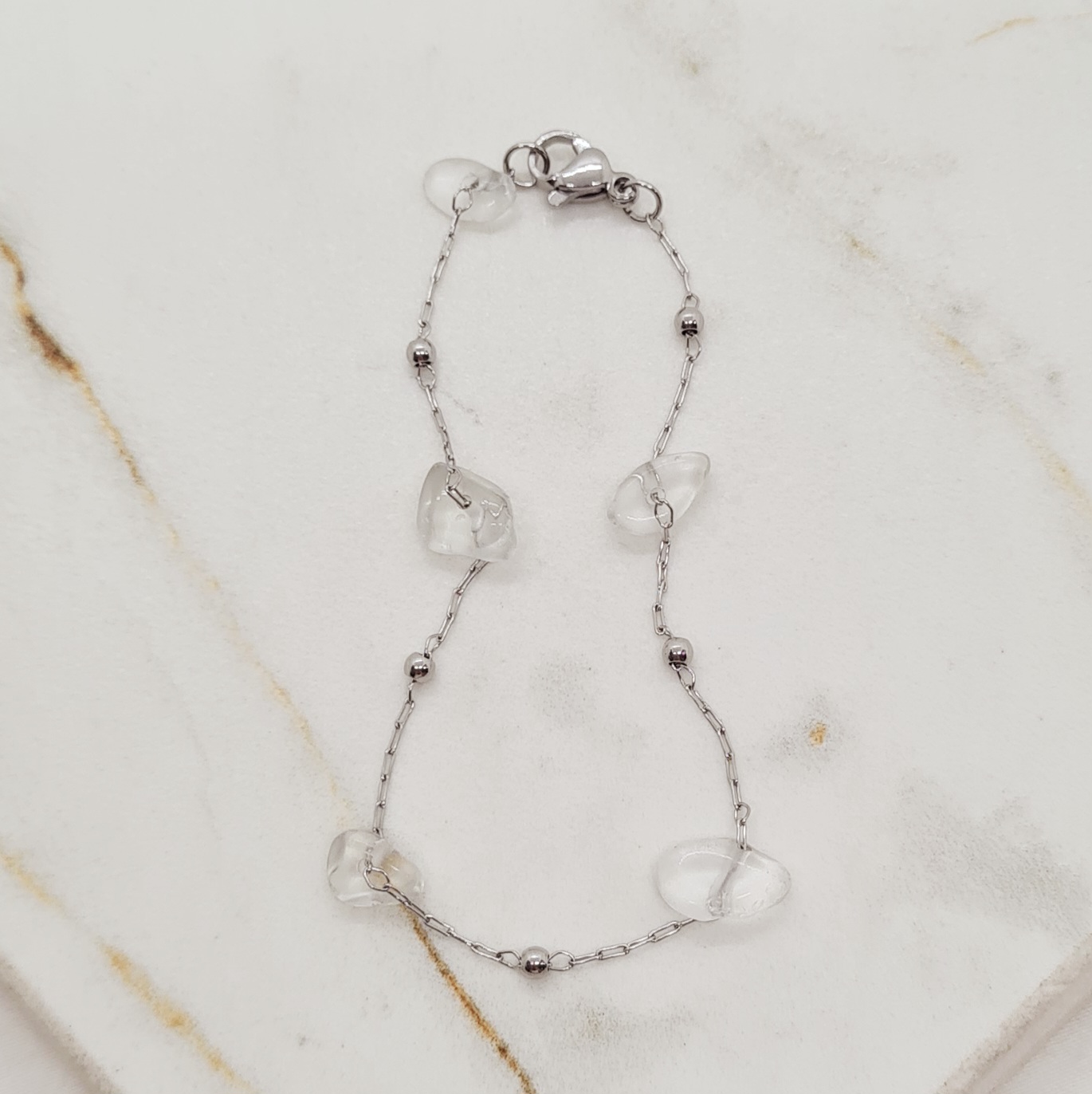 Imagen de producto PULSERA FINA CON BOLITAS Y PIEDRAS CUARZO CRISTAL