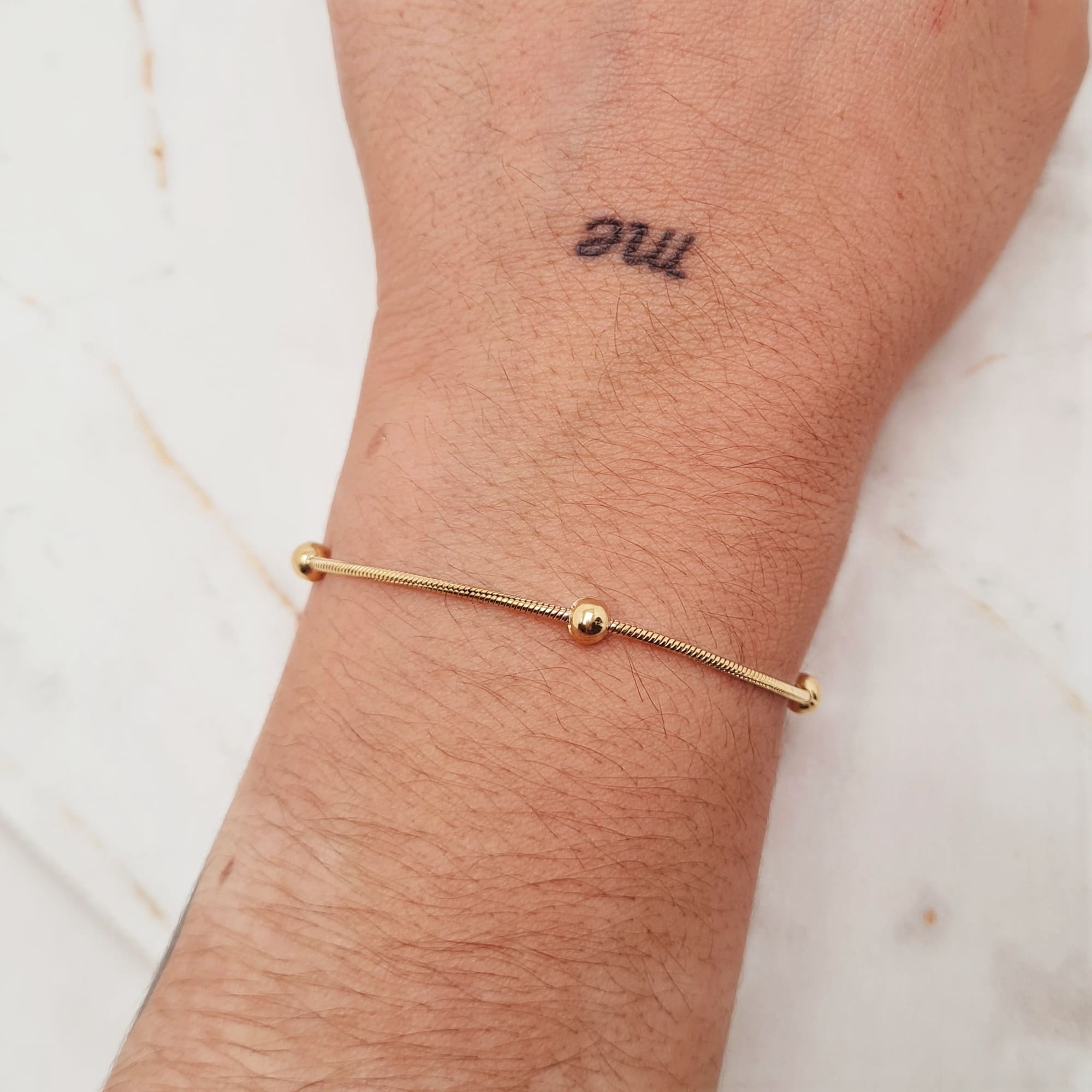 Imagen de producto PULSERA ACERO DORADO COLITA DE RATA CON BOLITAS