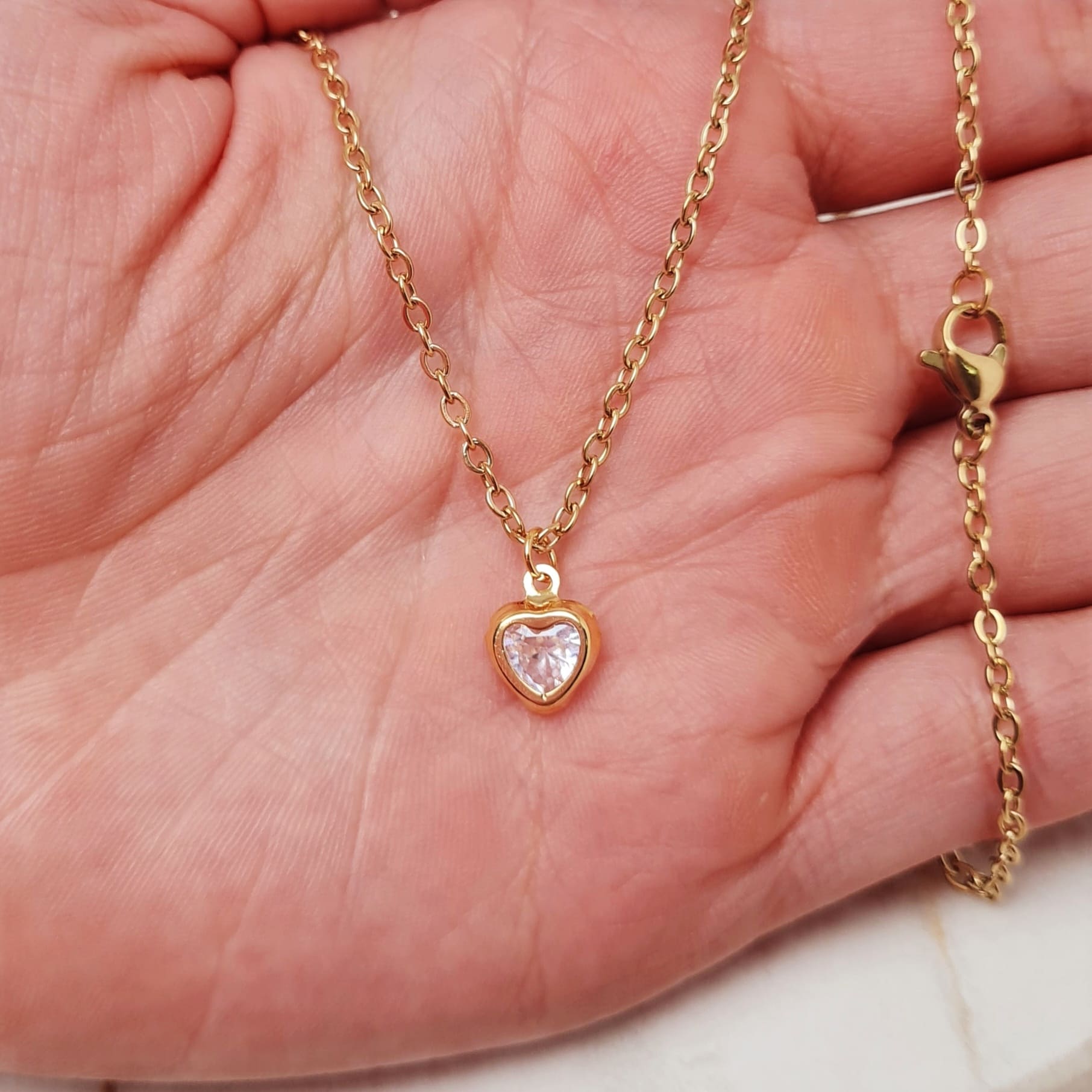 Imagen de producto COLLAR ACERO DORADO - CUBIC CORAZON TRANSPARENTE