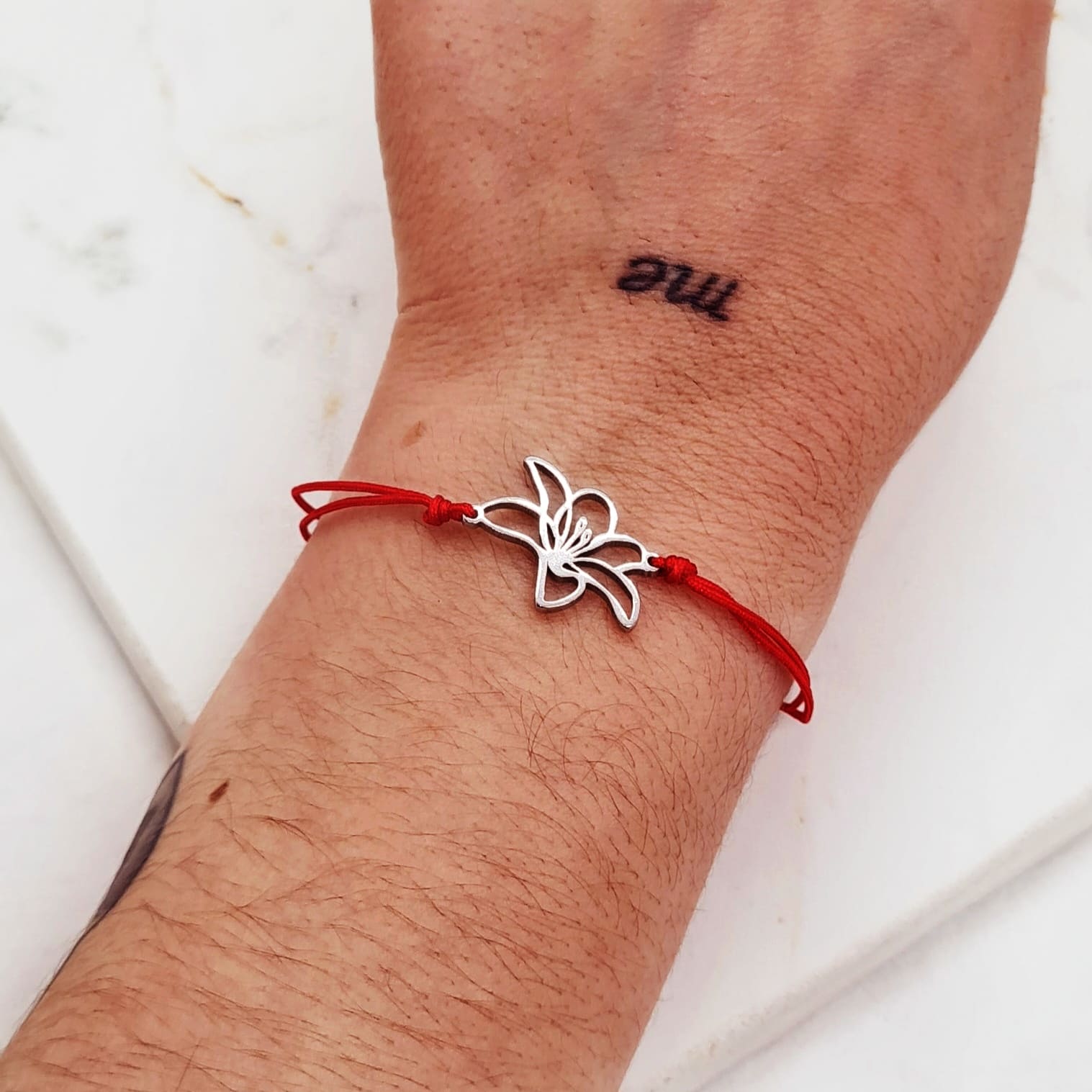 Imagen de producto PULSERA DE HILO ROJO - FLOR