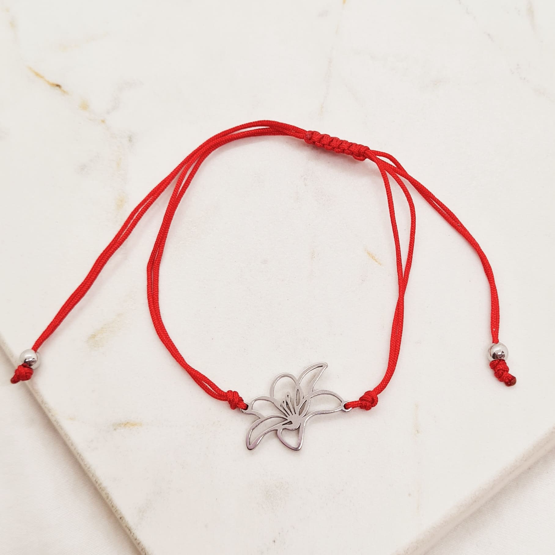 Imagen de producto PULSERA DE HILO ROJO - FLOR