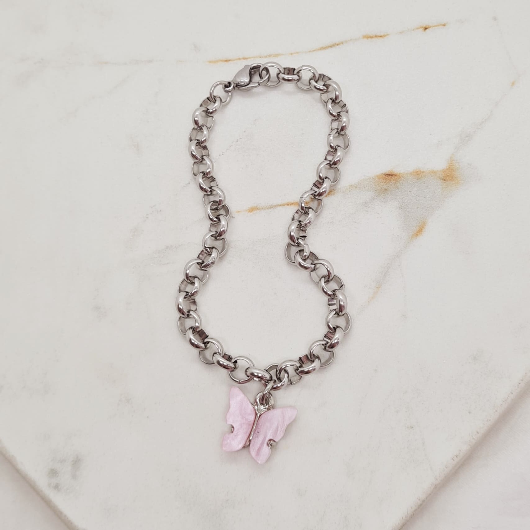 Imagen de producto PULSERA CON DIJE MARIPOSA - ROSA OSCURO