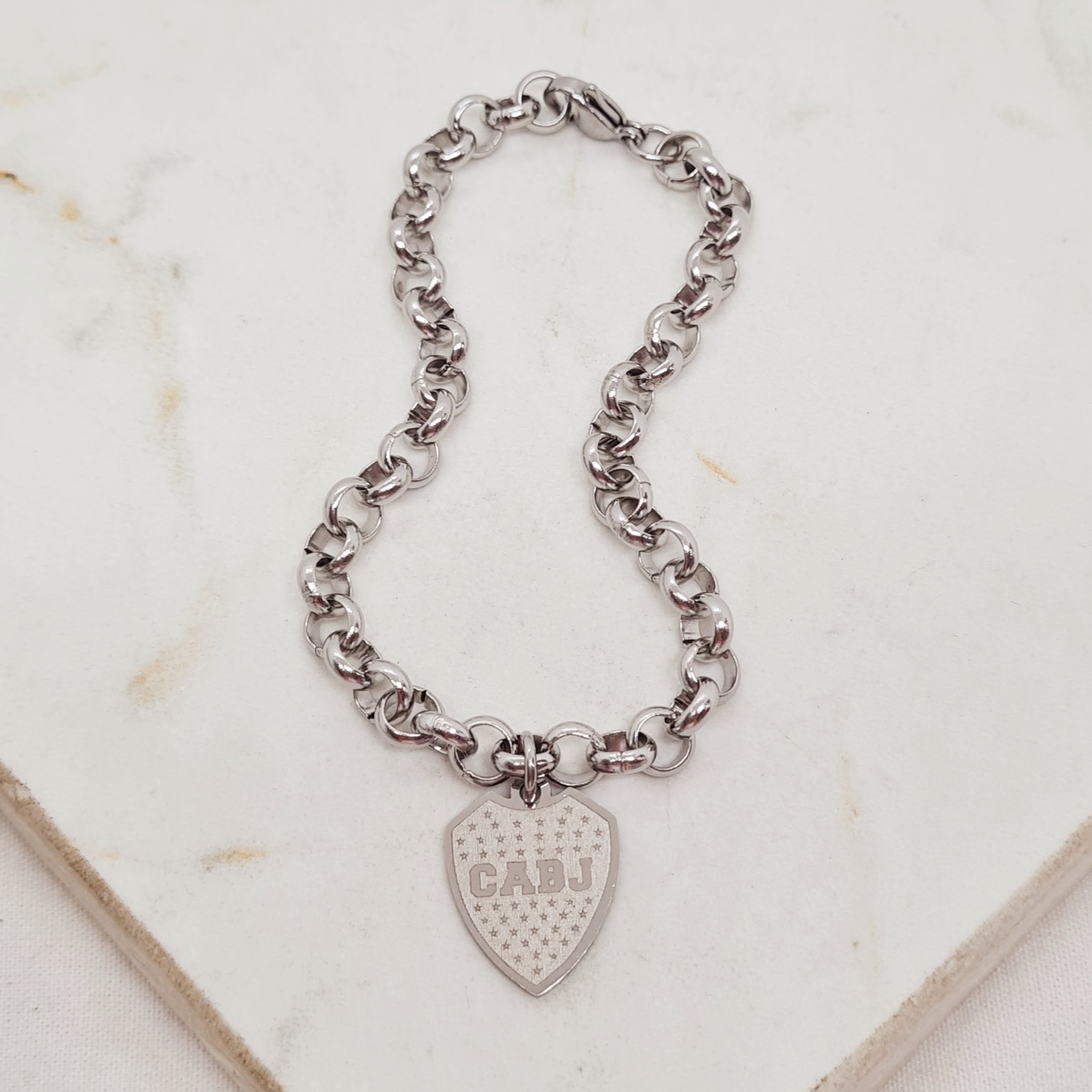 Imagen de producto PULSERA CON DIJE - ESCUDO DE BOCA