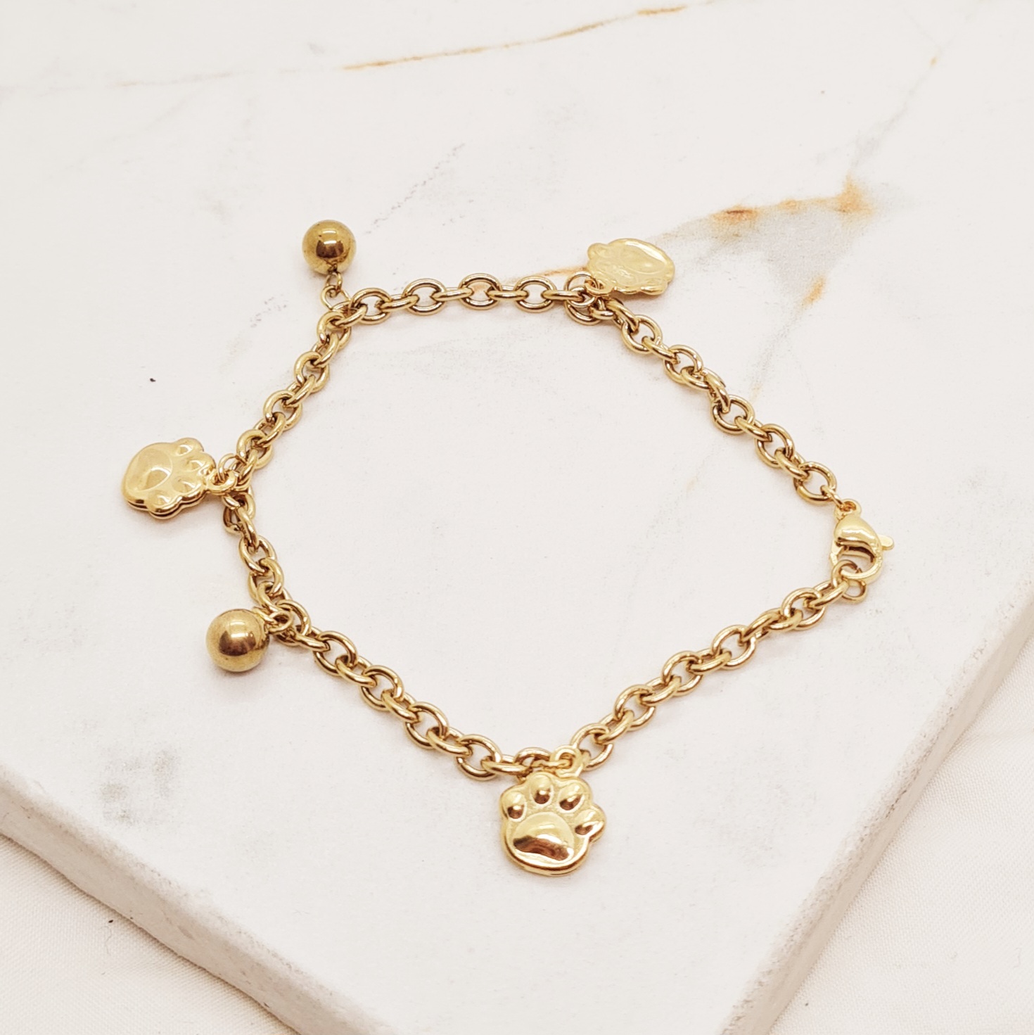 Imagen de producto PULSERA ACERO DORADO TIFFANY CON BOLITAS Y HUELLAS INFLADAS