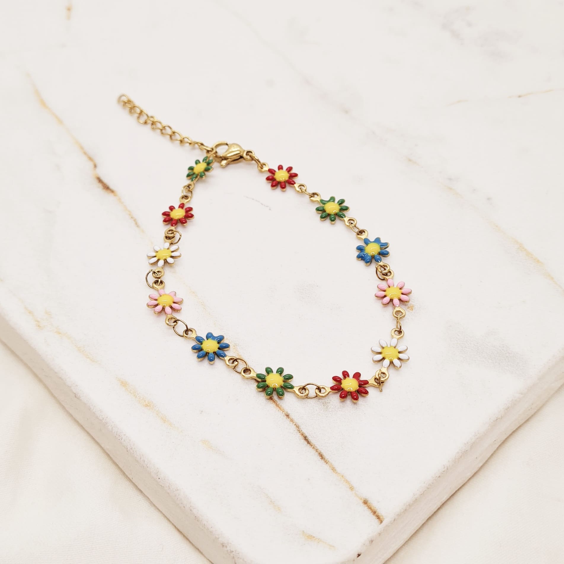 Imagen de producto PULSERA ACERO DORADO CON MARGARITAS DE COLORES