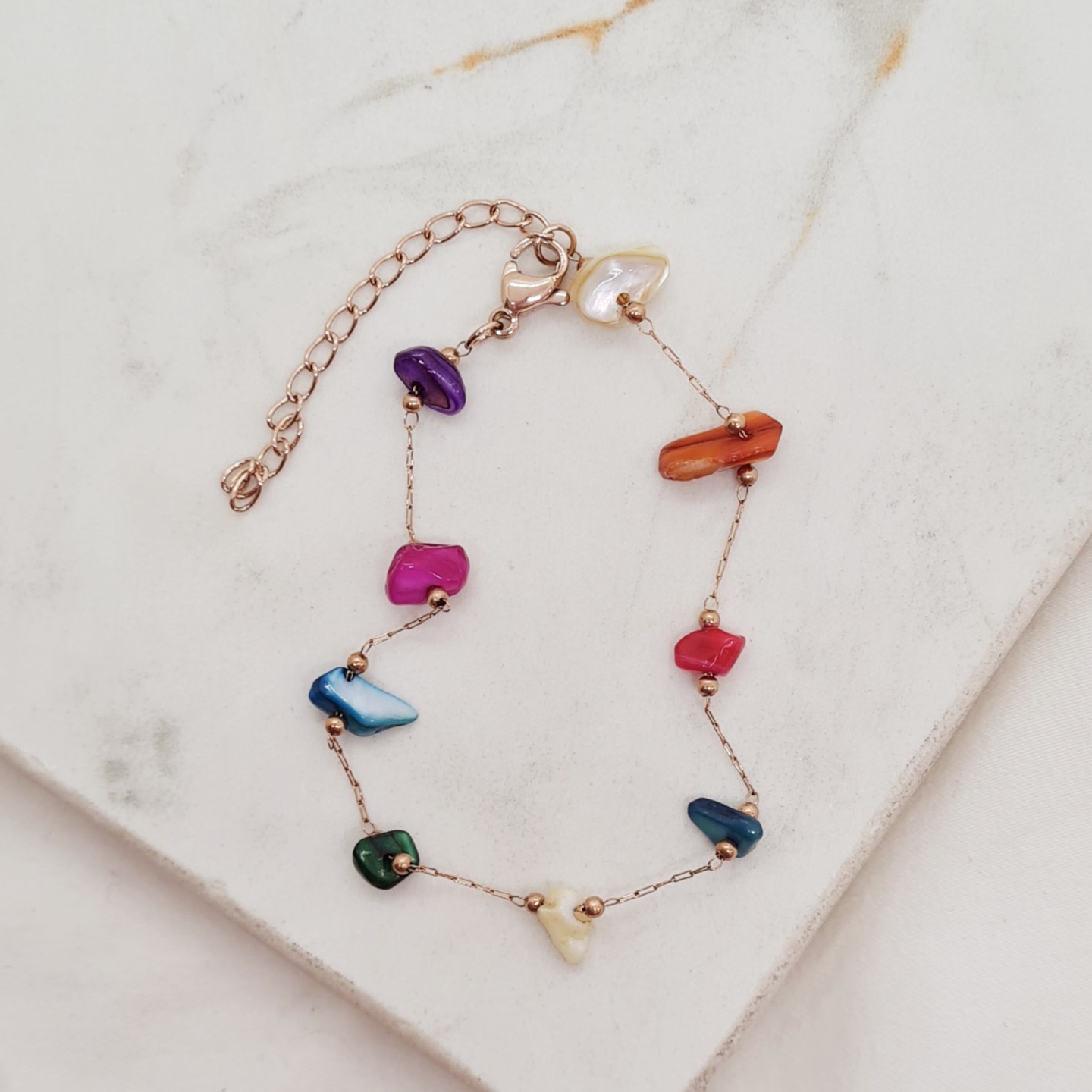 Imagen de producto PULSERA ACERO ROSE GOLD CON BOLITAS Y PIEDRITAS DE COLORES