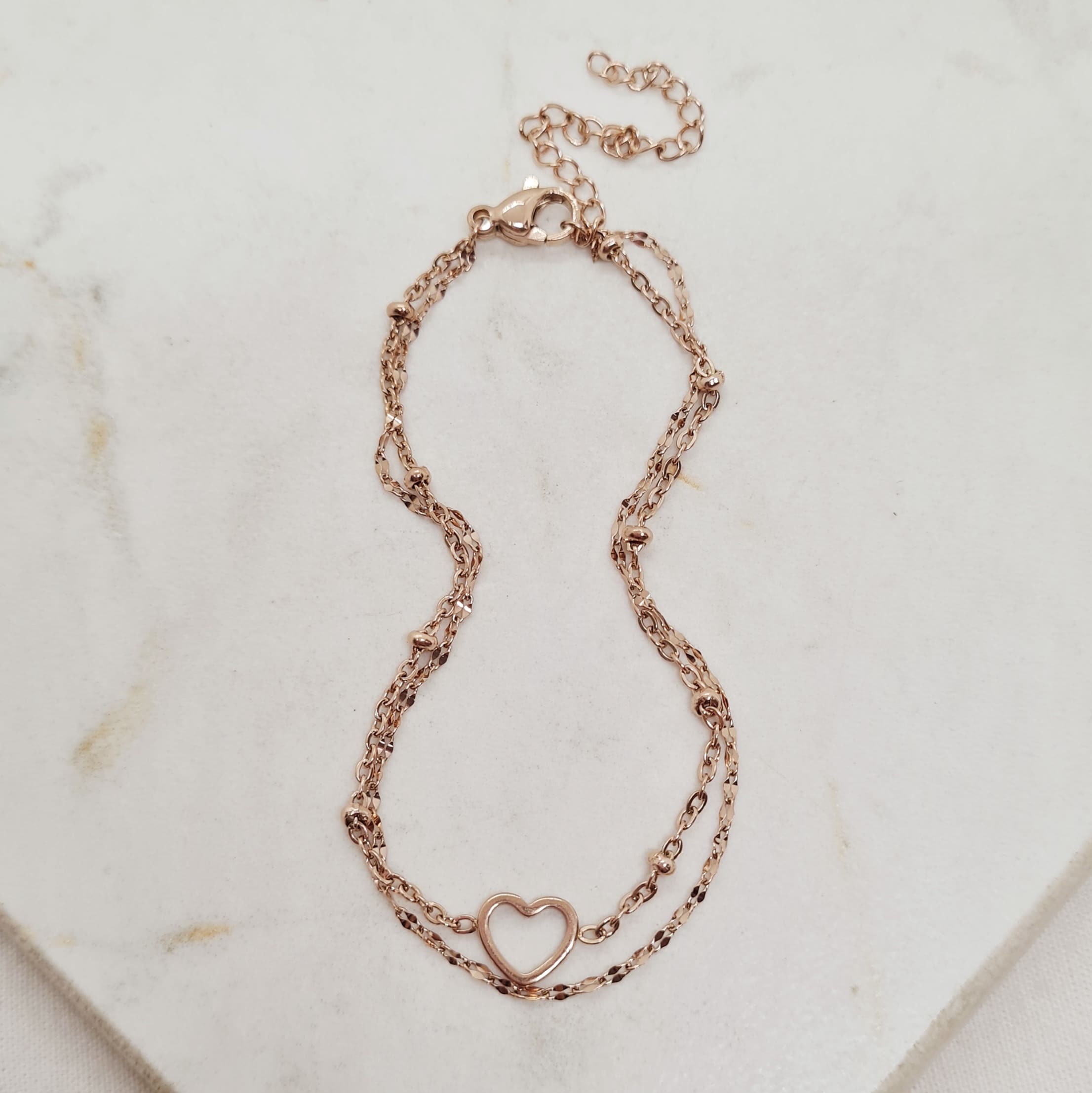 Imagen de producto PULSERA ACERO ROSE GOLD DOBLE CADENA CON BOLITAS Y CORAZON ENGARZADO