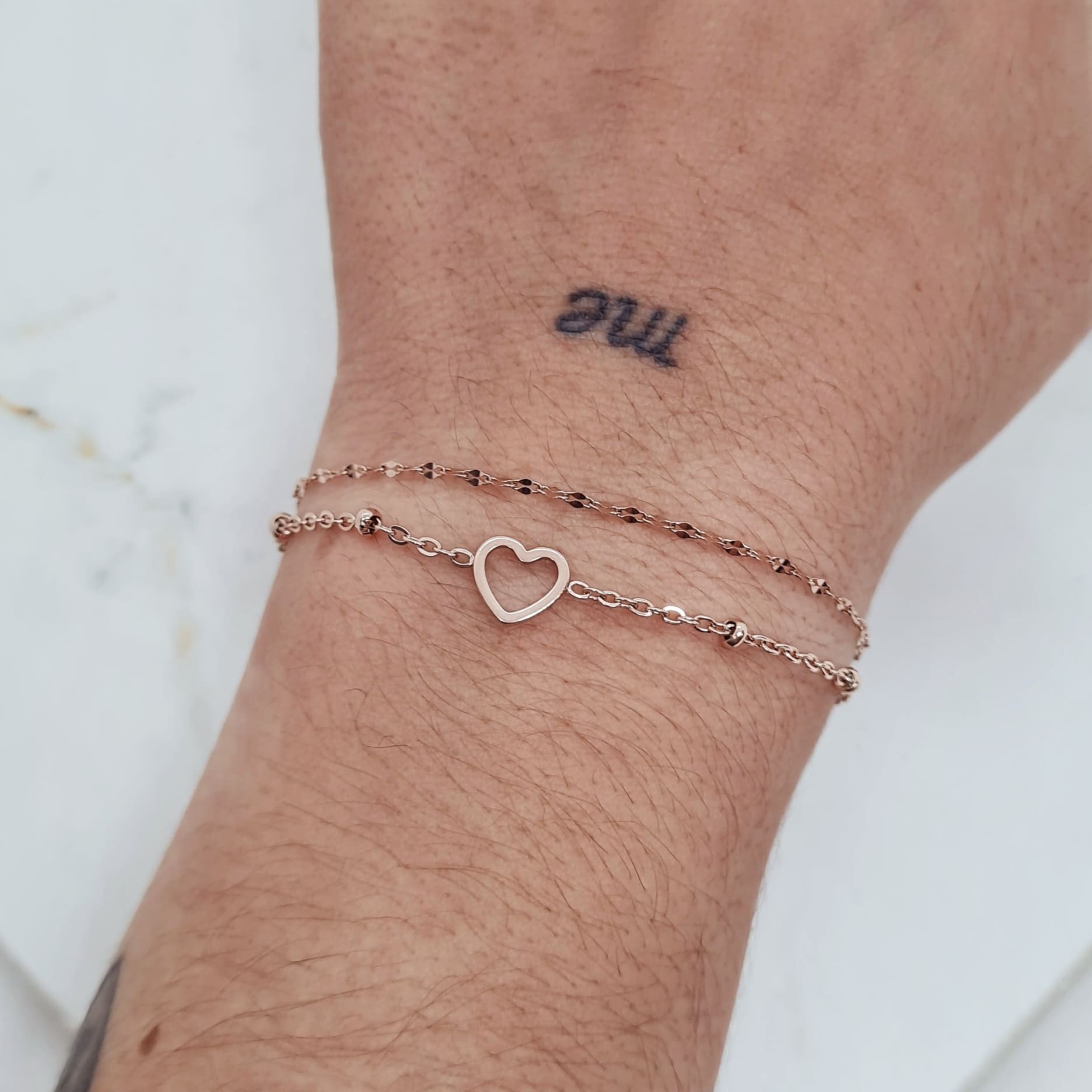 Imagen de producto PULSERA ACERO ROSE GOLD DOBLE CADENA CON BOLITAS Y CORAZON ENGARZADO