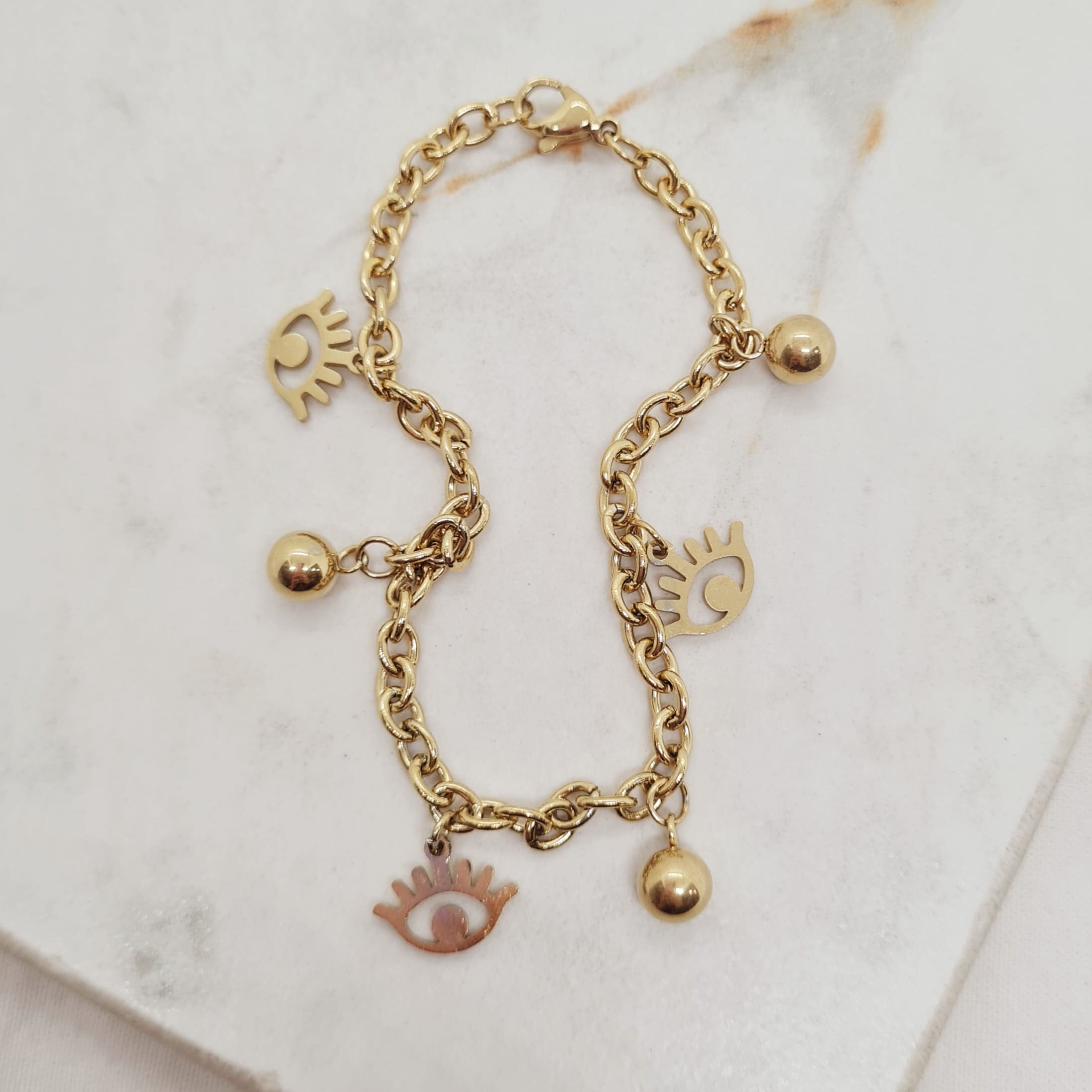 Imagen de producto PULSERA ACERO DORADO TIFFANY CON BOLITAS Y OJO TURCO