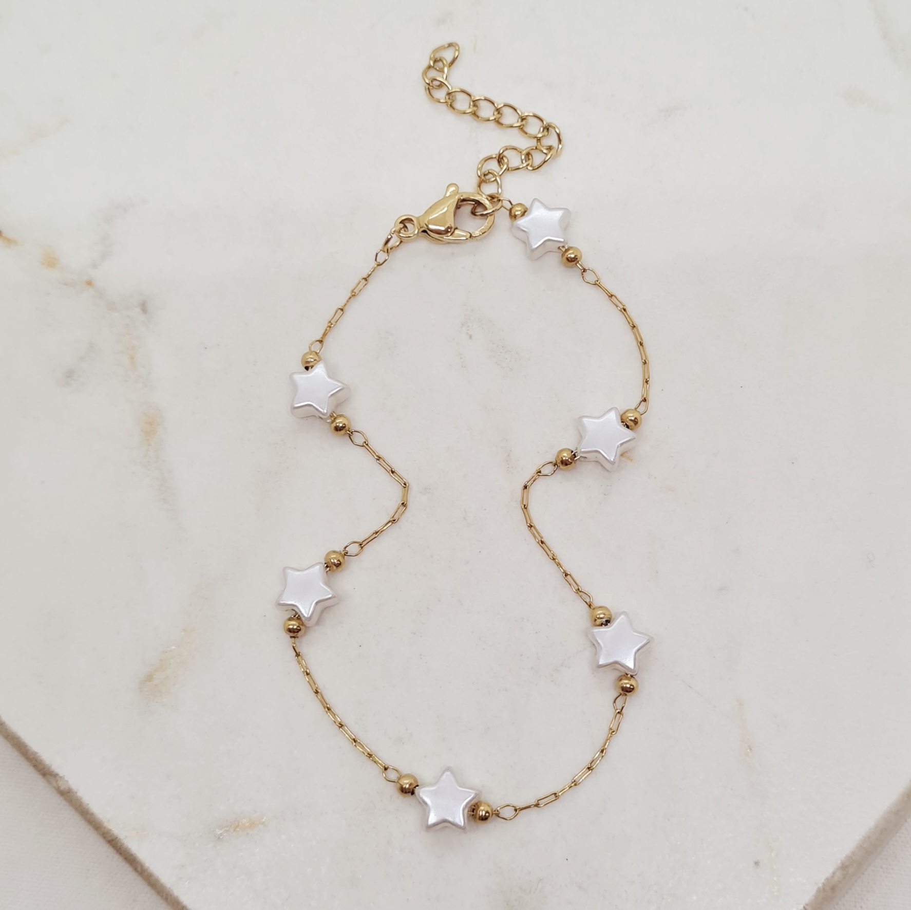 Imagen de producto PULSERA ACERO DORADO FINA CON BOLITAS Y PERLITAS ESTRELLAS