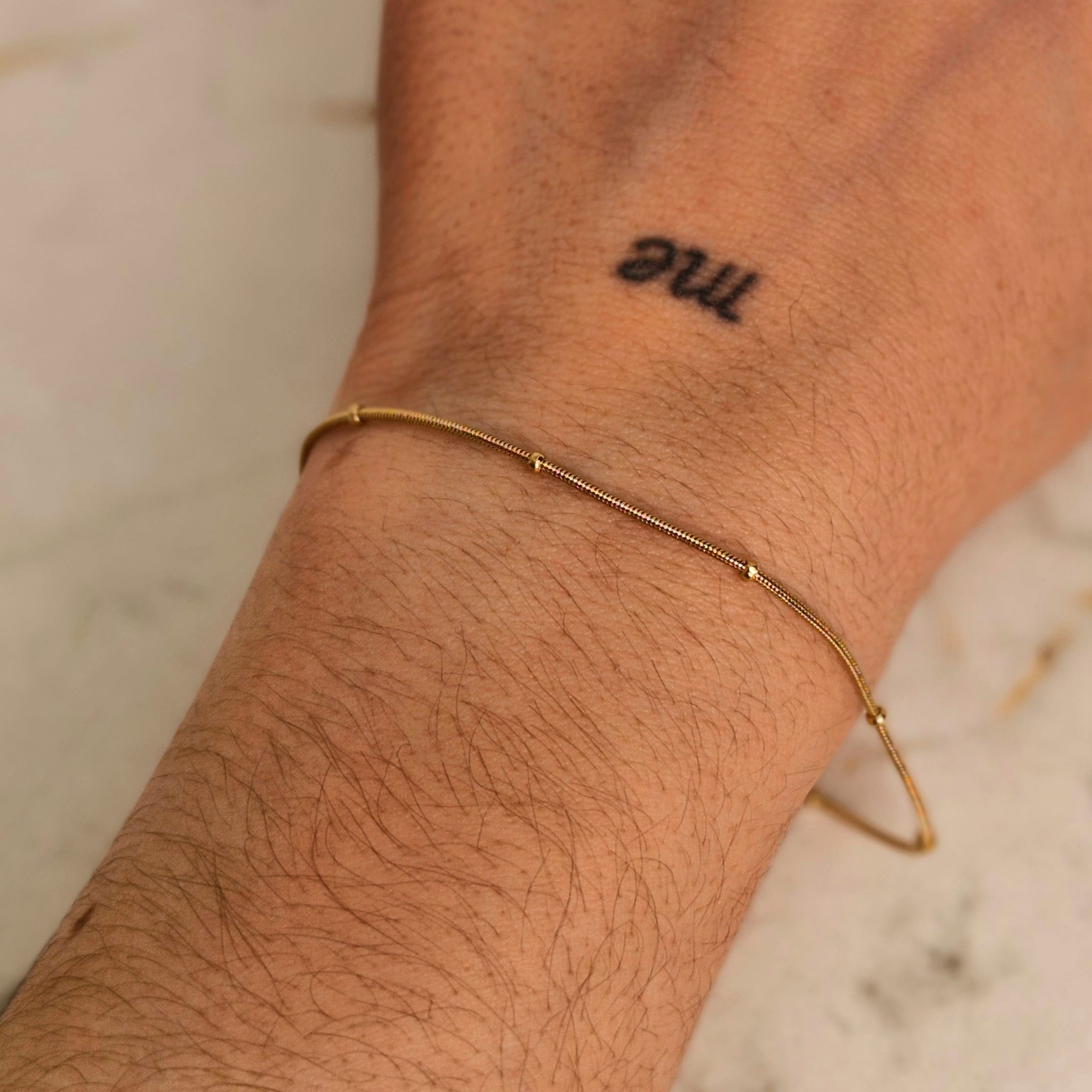 Imagen de producto PULSERA ACERO DORADO COLITA DE RATA FINA CON BOLITAS CHICAS