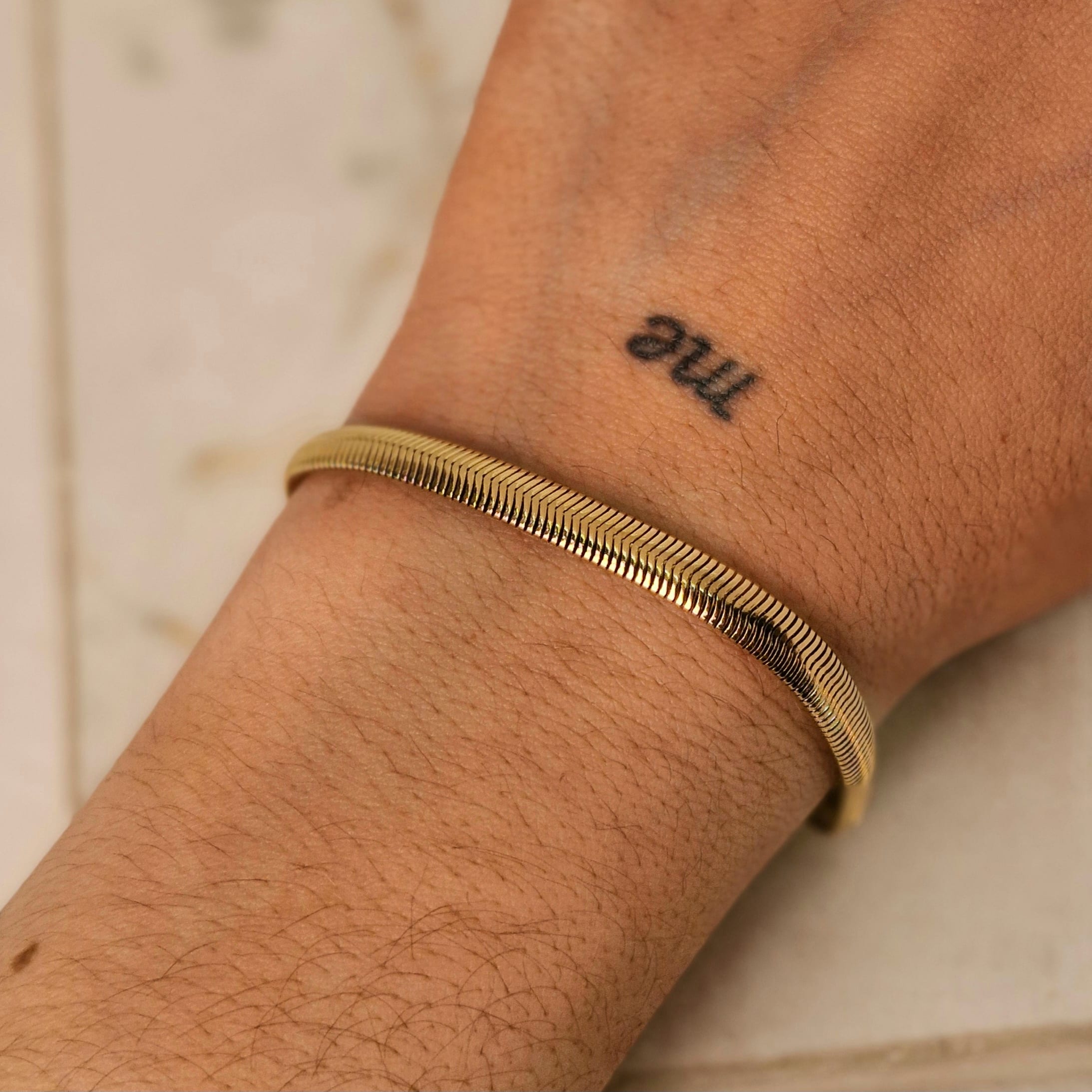 Imagen de producto PULSERA ACERO DORADO SERPIENTE GRUESA