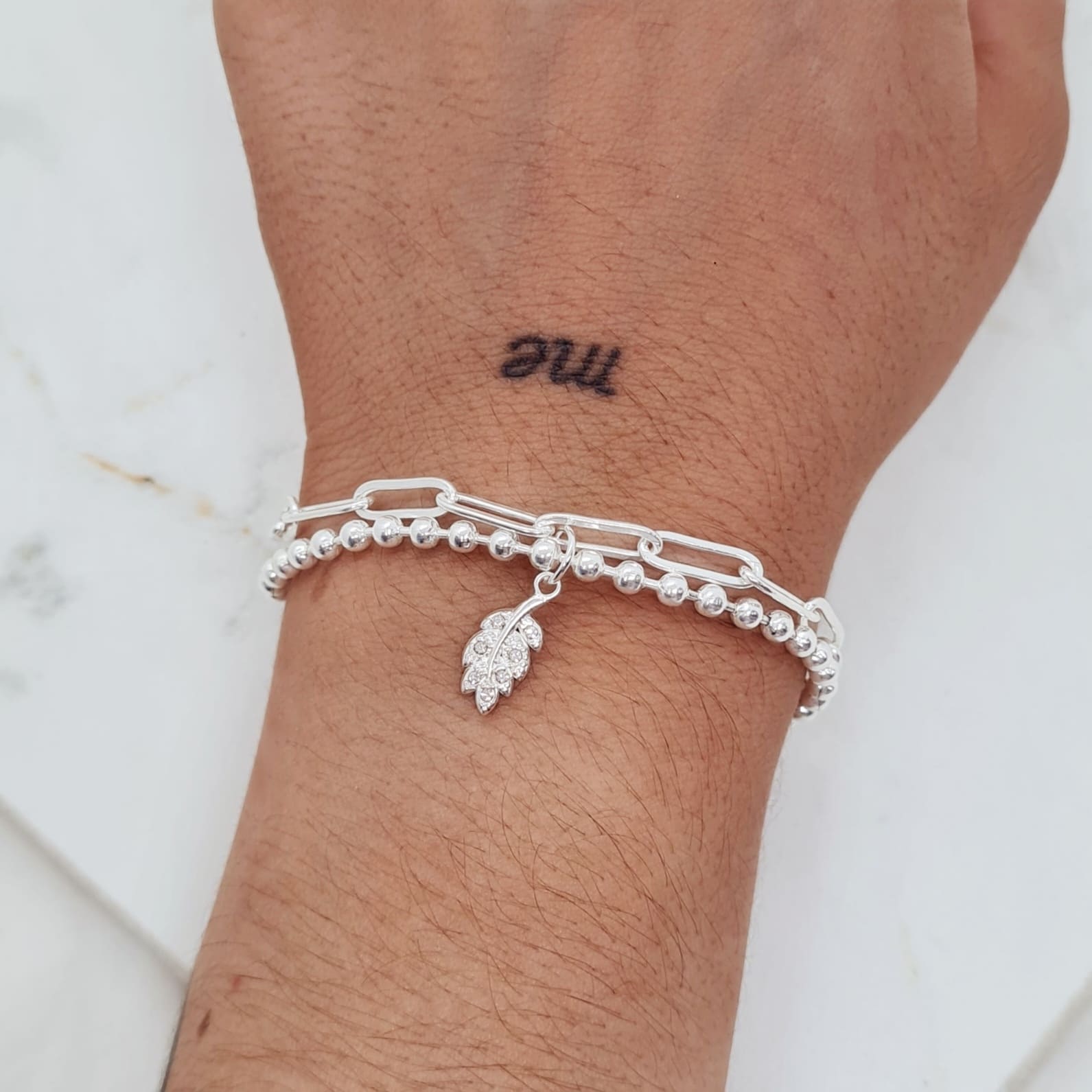 Imagen de producto PULSERA ACERO BLANCO DOBLE CADENA ALICE Y BOLITAS - HOJITA CON MICROCRISTALES