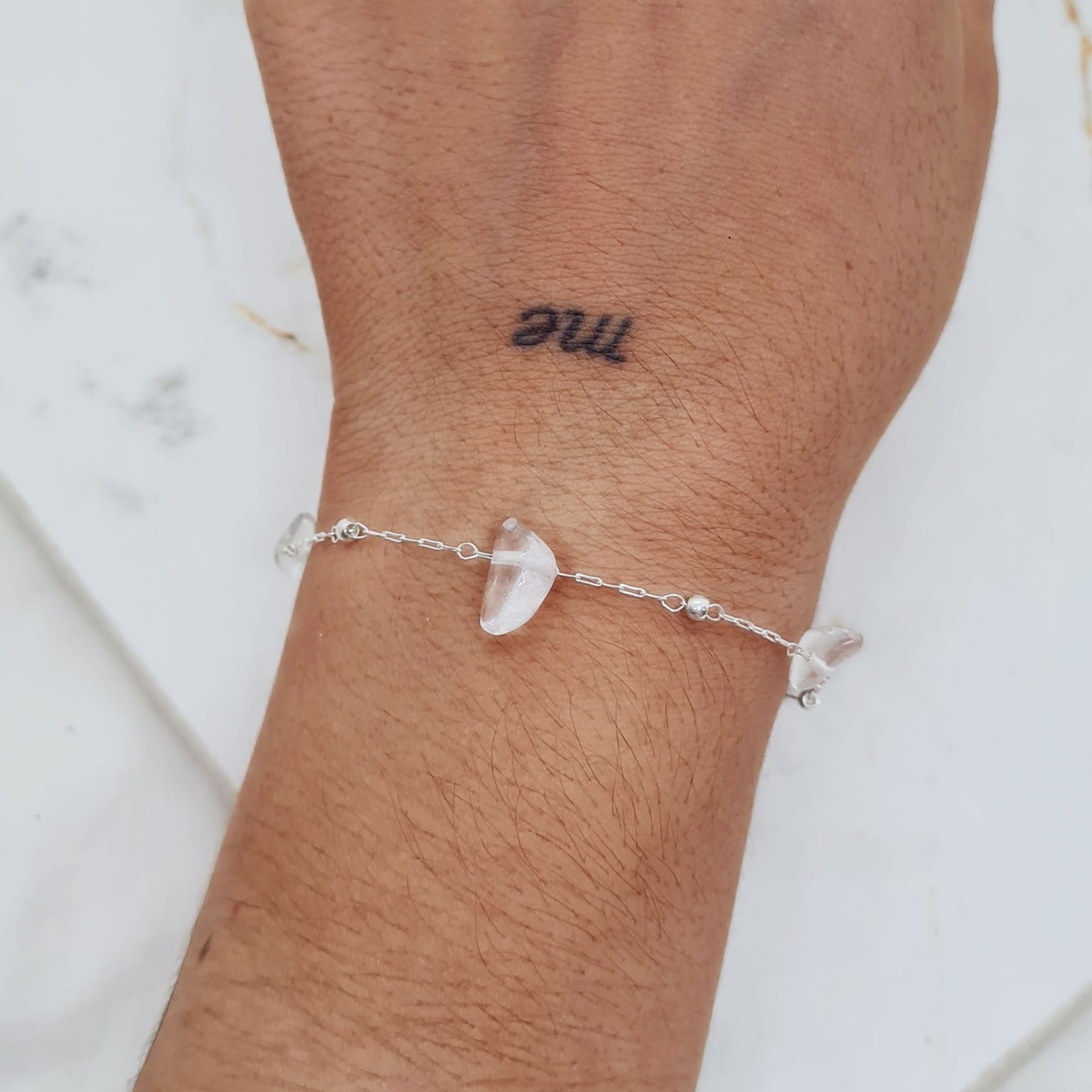Imagen de producto PULSERA ACERO BLANCO CON BOLITAS Y PIEDRA CUARZO CRISTAL