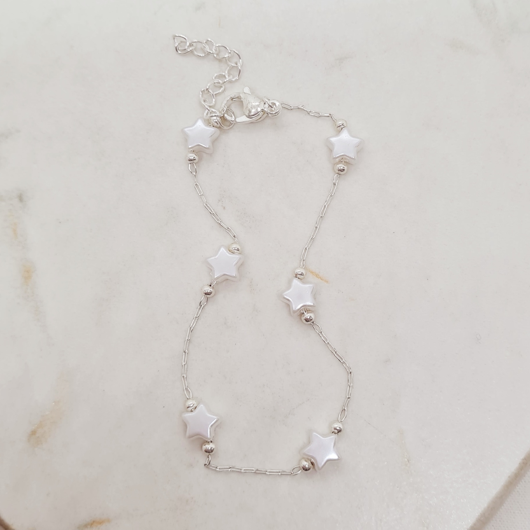Imagen de producto PULSERA ACERO BLANCO FINA CON BOLITAS Y PERLITAS ESTRELLAS