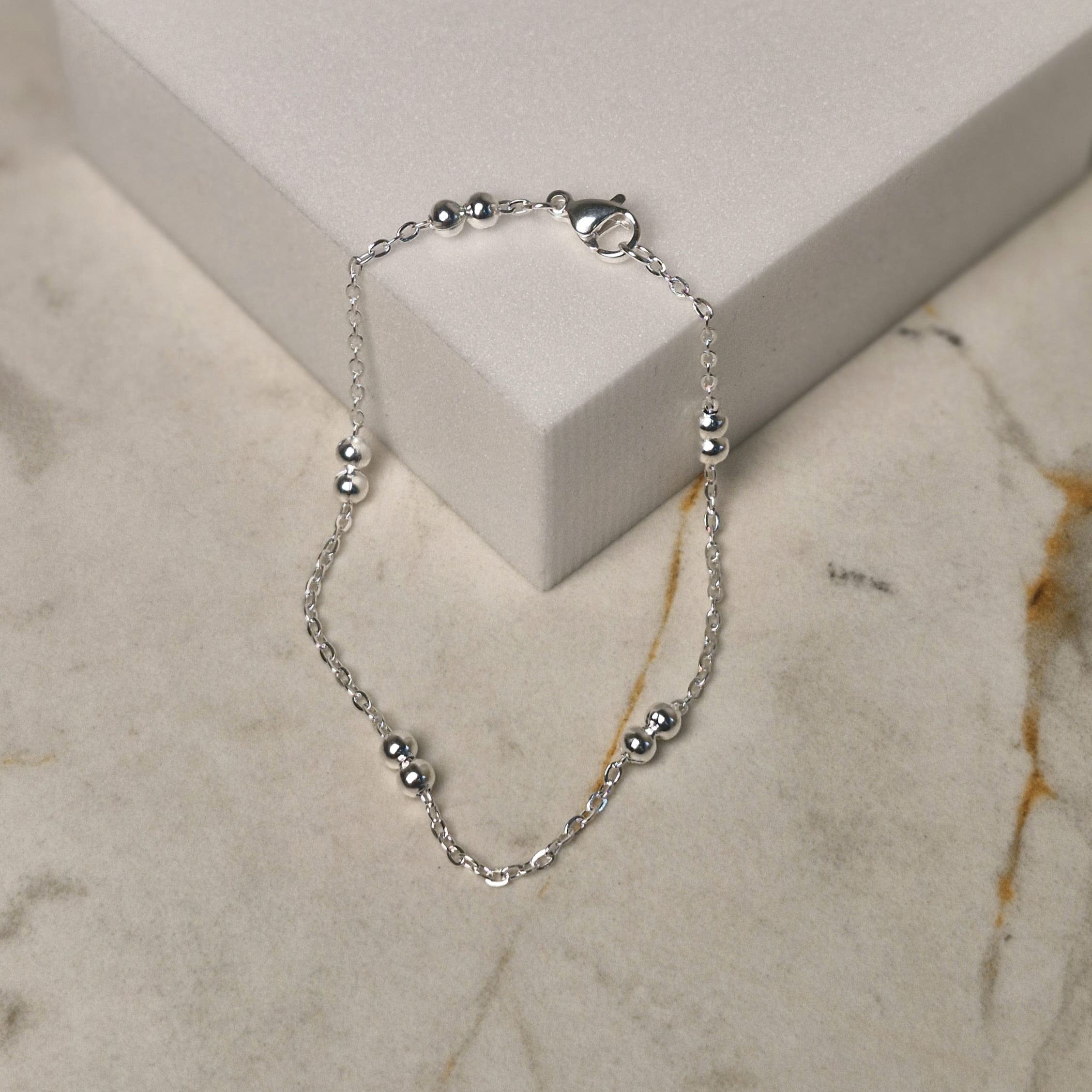 Imagen de producto PULSERA ACERO BLANCO CON BOLITAS DOBLES
