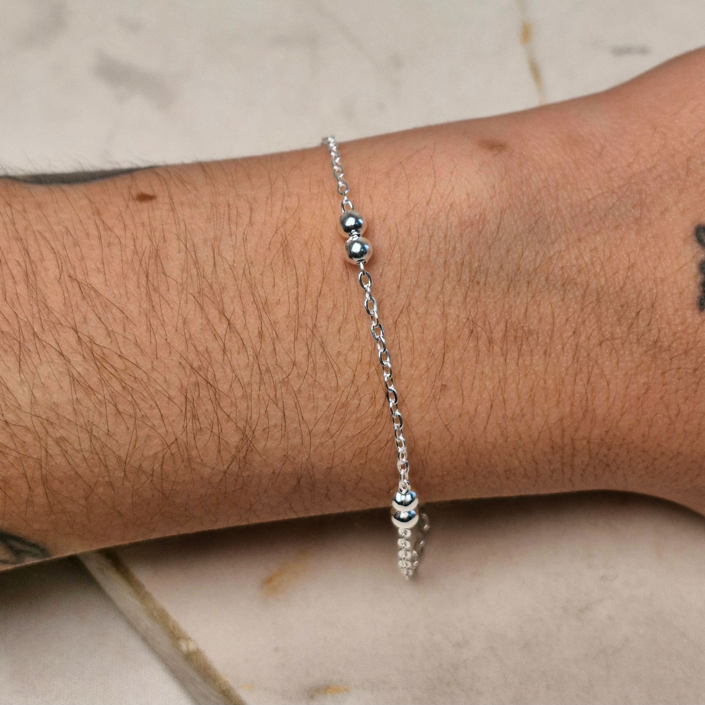 Imagen de producto PULSERA ACERO BLANCO CON BOLITAS DOBLES
