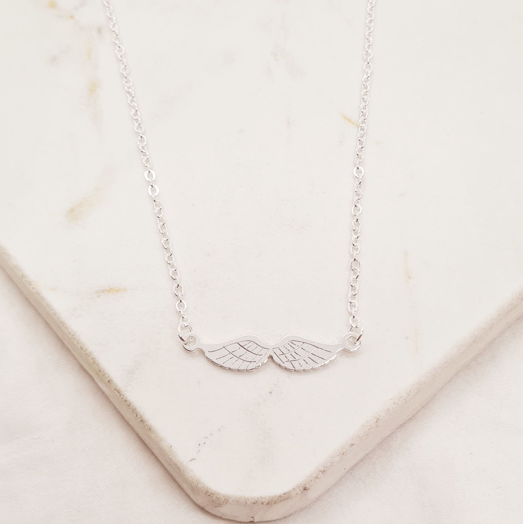 Imagen de producto COLLAR ACERO BLANCO DOBLE ALAS