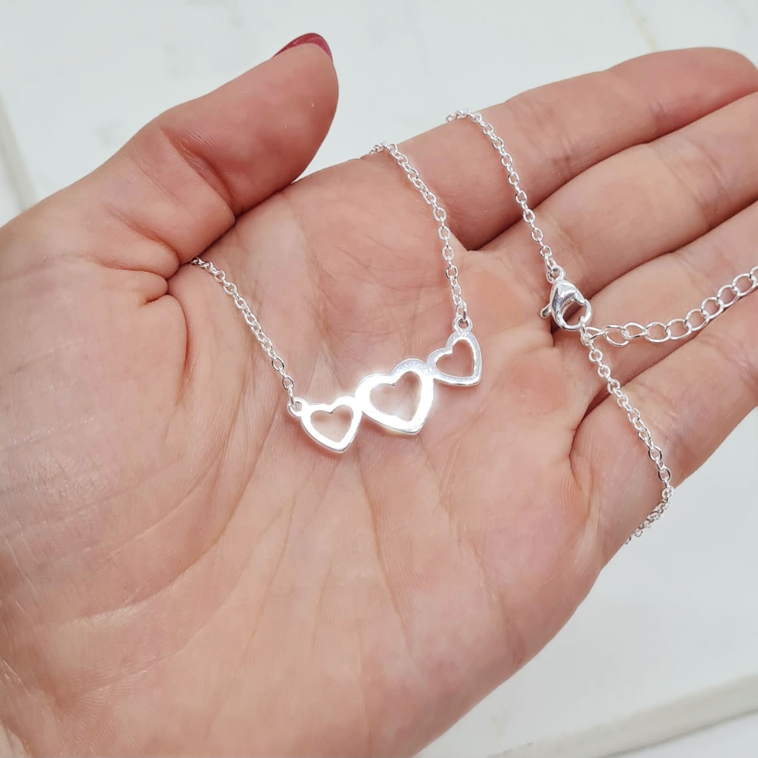 Imagen de producto COLLAR ACERO BLANCO ENGARZADO - TRIPLE CORAZON CALADO