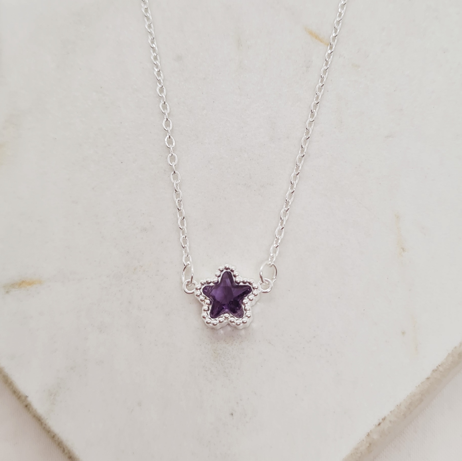 Imagen de producto COLLAR ACERO BLANCO ENGARZADO - ESTRELLA VIOLETA