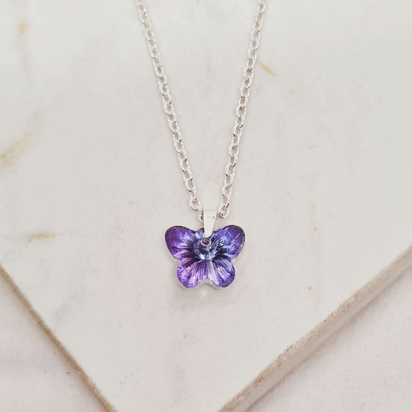 Imagen de producto COLLAR ACERO BLANCO CRISTAL CHICO - MARIPOSA TORNASOL VIOLETA