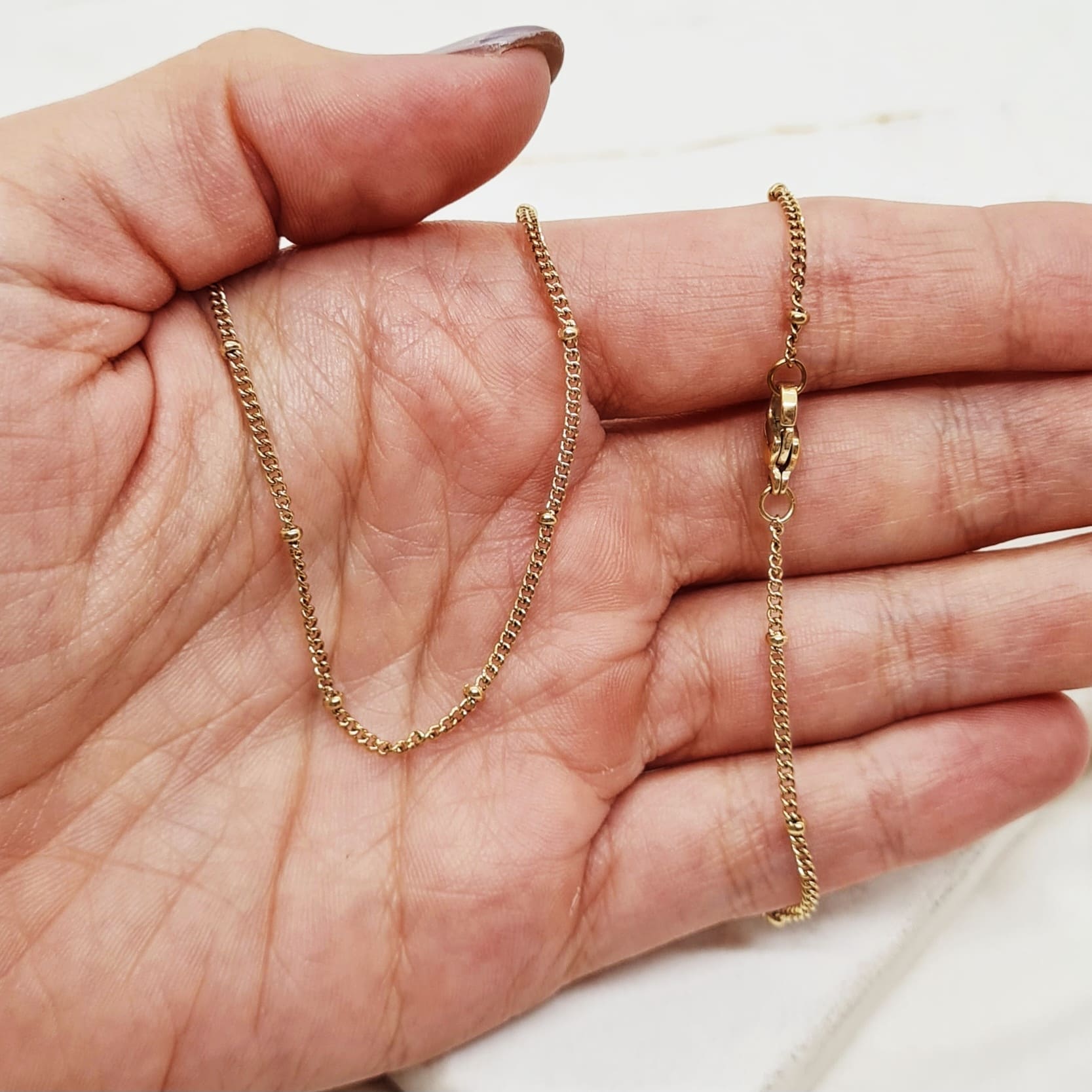 Imagen de producto CADENA ACERO DORADO ESLABON PLANO CON BOLITAS
