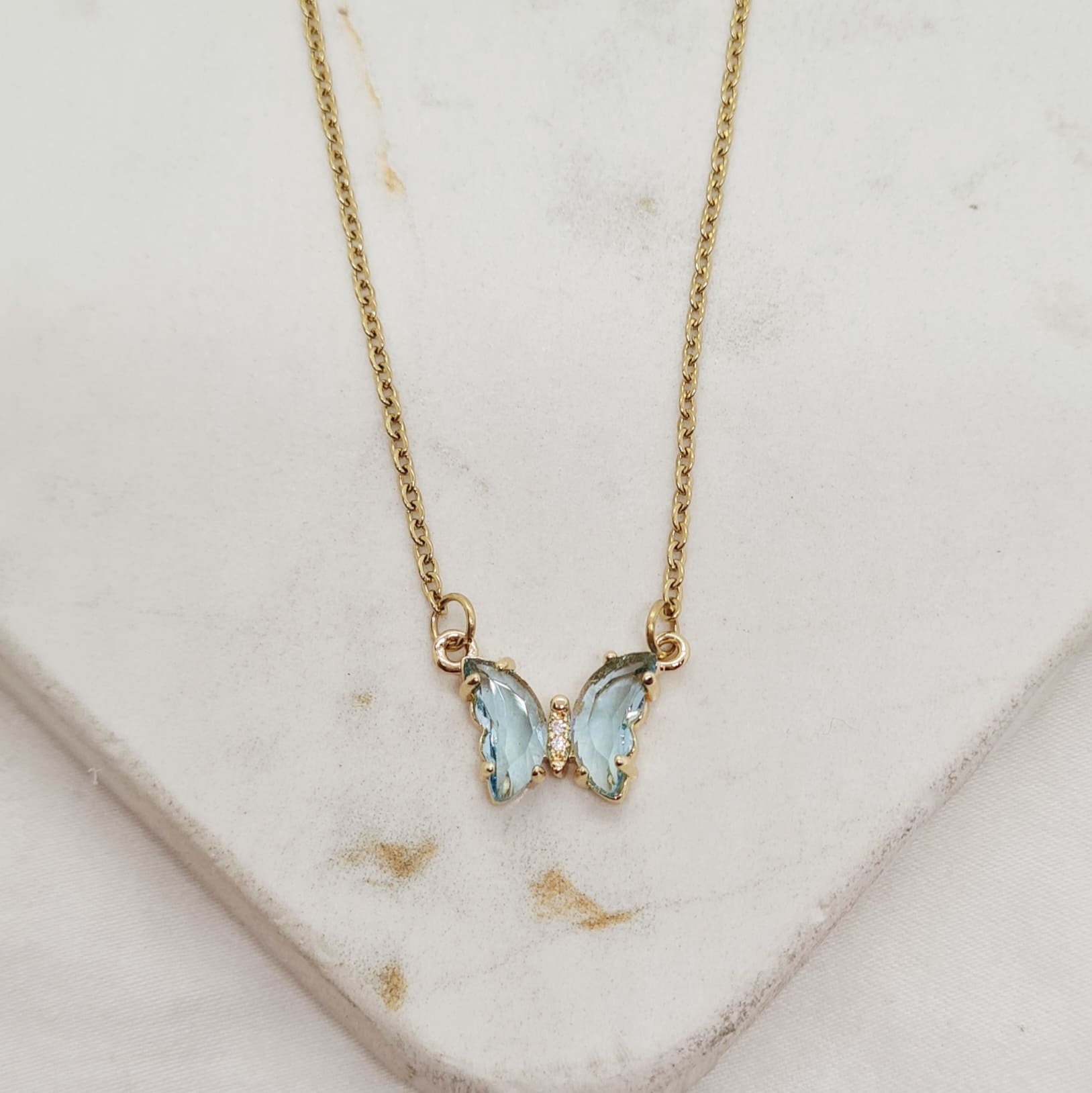 Imagen de producto COLLAR ACERO DORADO ENGARZADO - MARIPOSA CELESTE