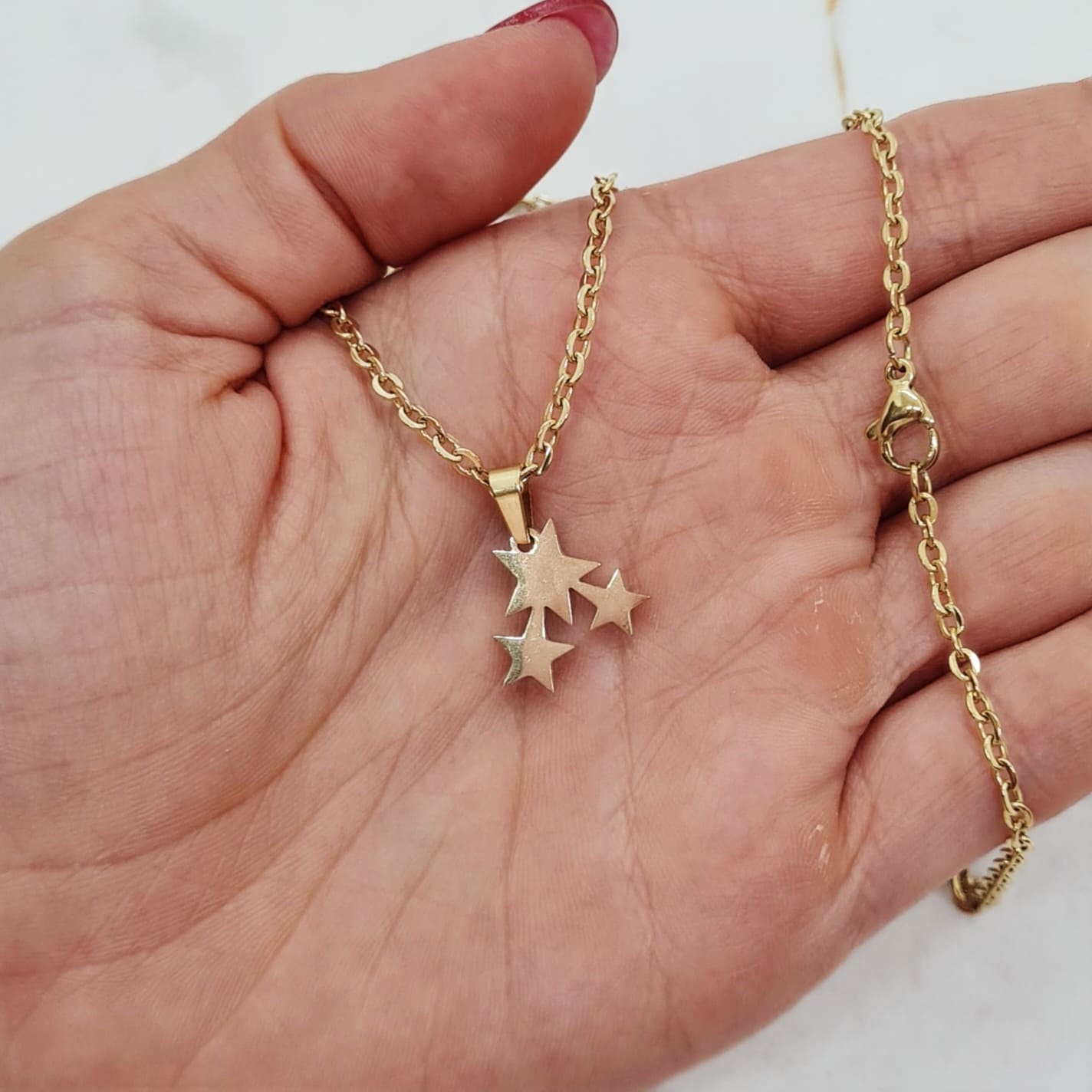 Imagen de producto COLLAR ACERO DORADO - ESTRELLAS LISAS