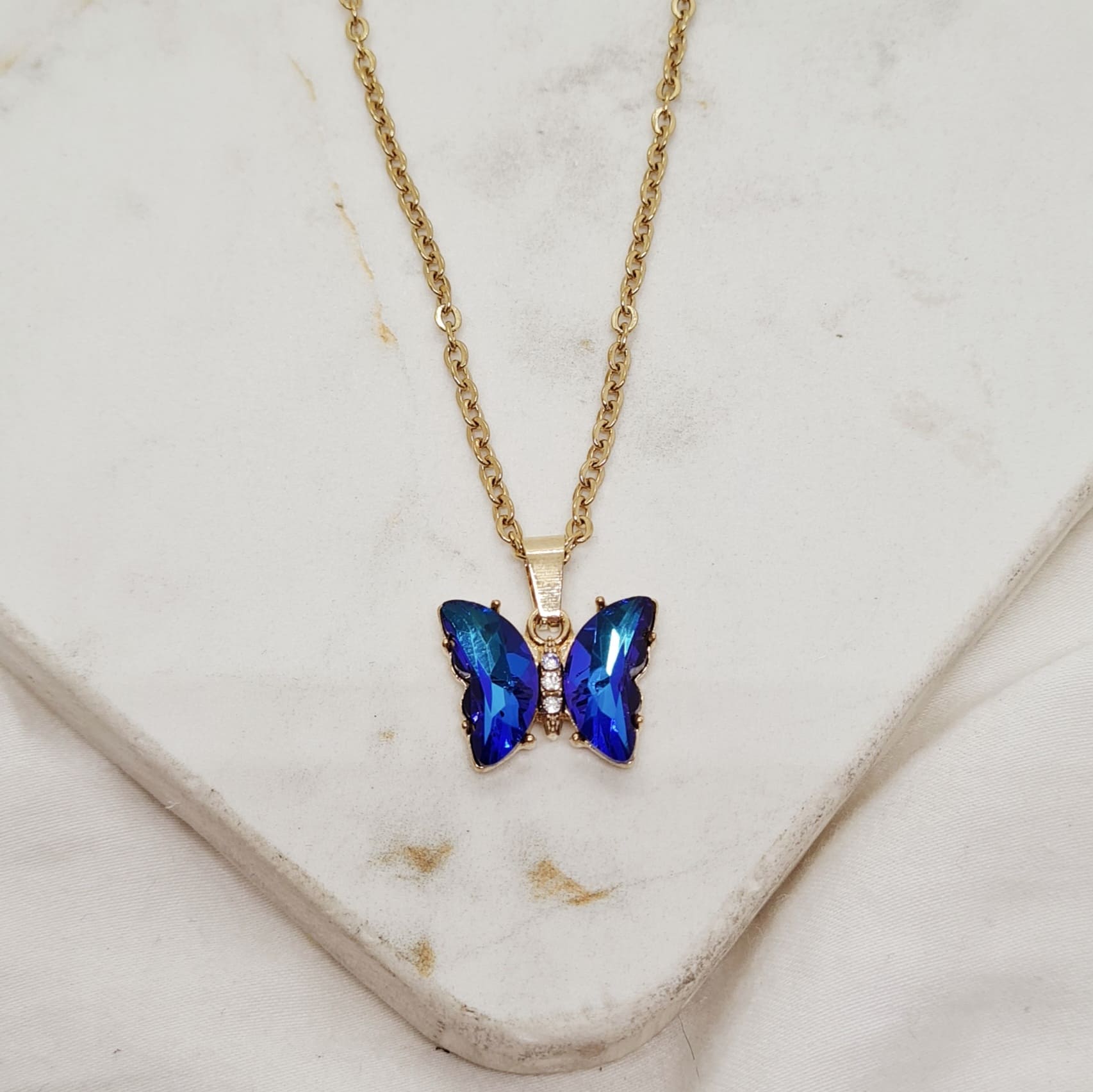 Imagen de producto COLLAR ACERO DORADO MARIPOSA DE CRISTAL ENGARZADA - AZUL