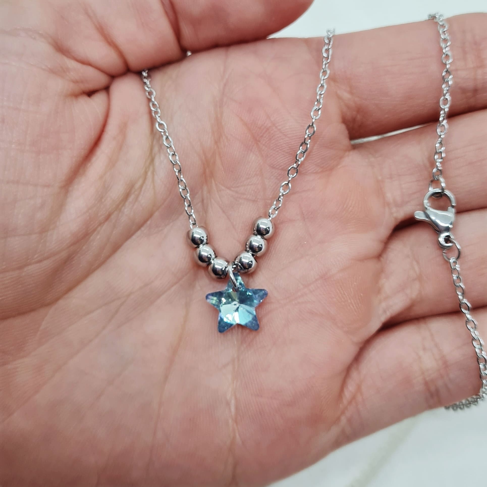 Imagen de producto COLLAR CON BOLITAS - ESTRELLA CELESTE