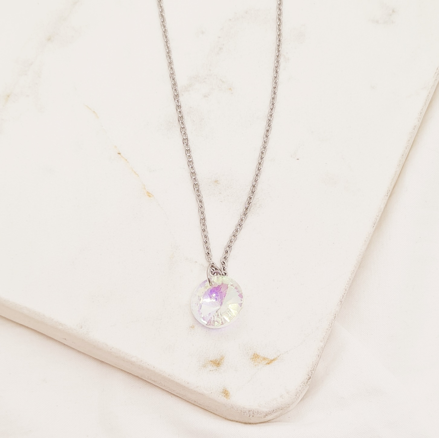 Imagen de producto COLLAR CRISTAL TORNASOLADO CLARO - REDONDO