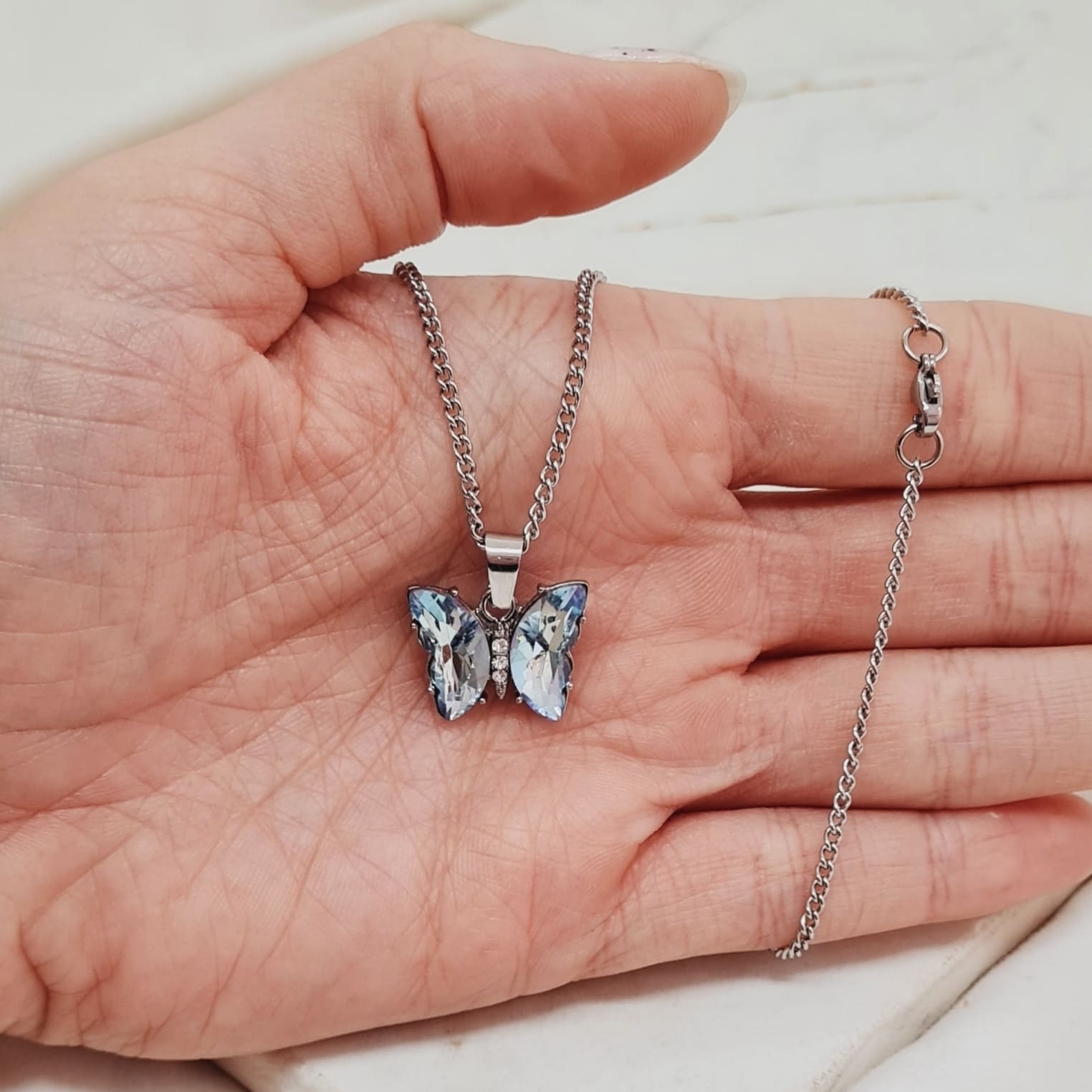 Imagen de producto COLLAR MARIPOSA DE CRISTAL ENGARZADA - CELESTE