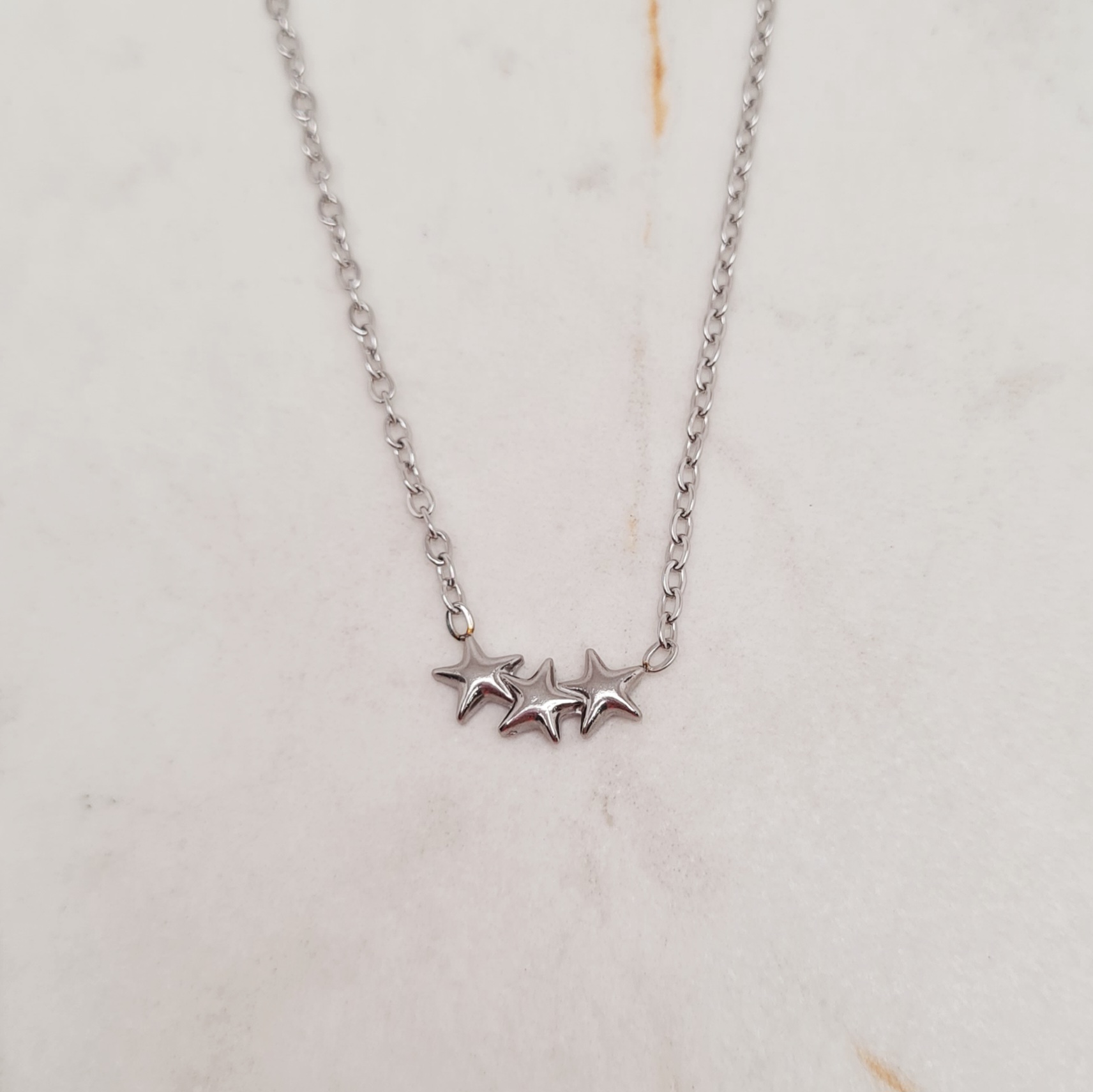Imagen de producto COLLAR TRIPLE ESTRELLITAS ENGARZADAS