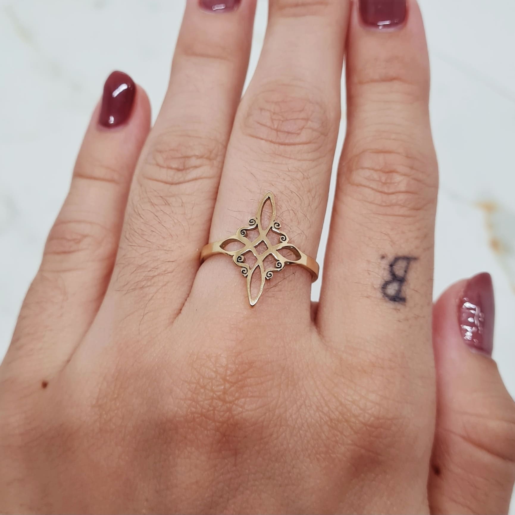 Imagen de producto ANILLO ACERO DORADO - NUDO DE BRUJAS