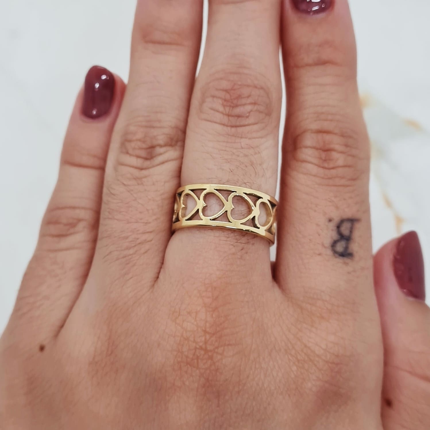 Imagen de producto ANILLO ACERO DORADO - DOBLE LINEA CORAZONES HORIZONTALES