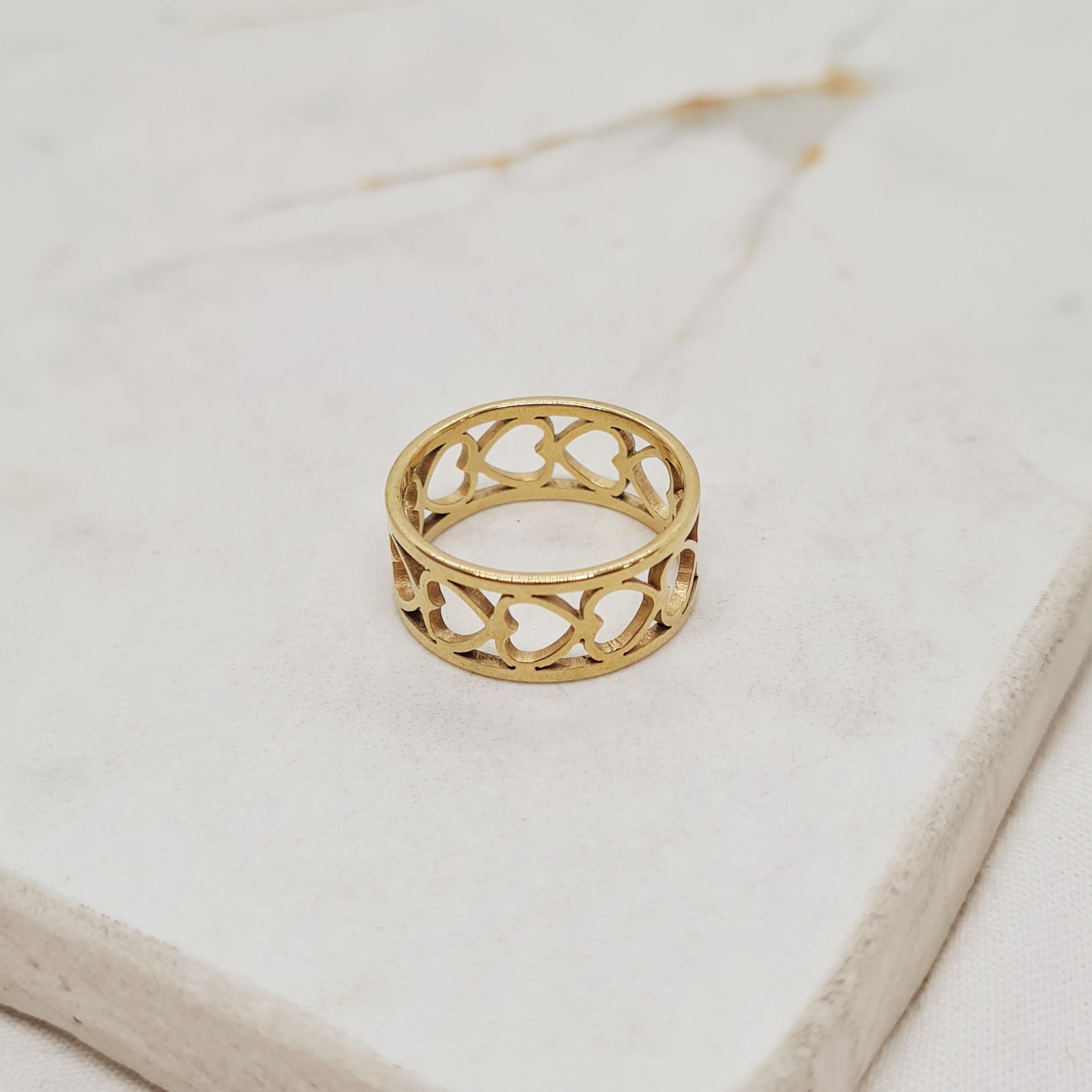 Imagen de producto ANILLO ACERO DORADO - DOBLE LINEA CORAZONES HORIZONTALES