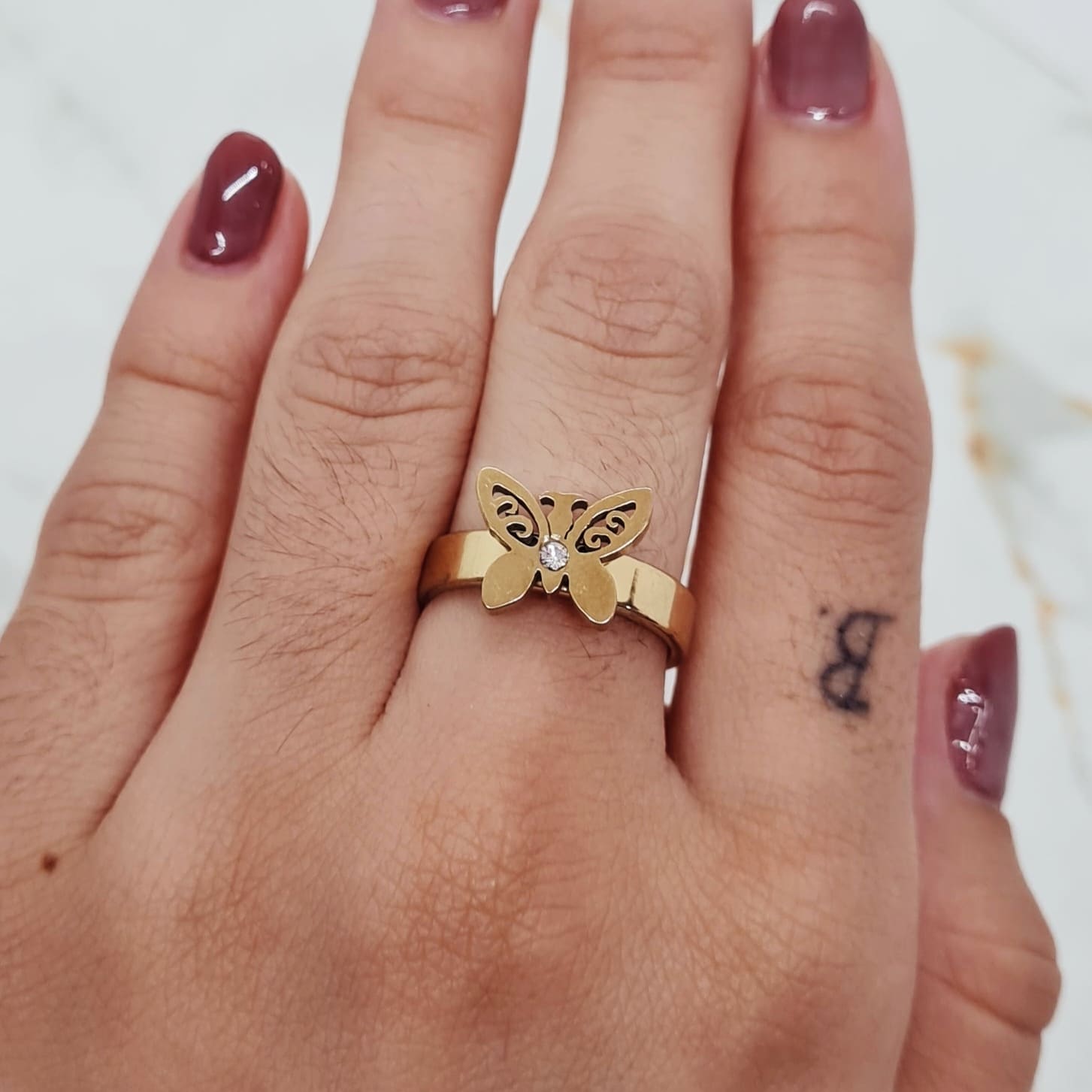 Imagen de producto ANILLO ACERO DORADO CON FORMA Y STRASS BLANCO - MARIPOSA