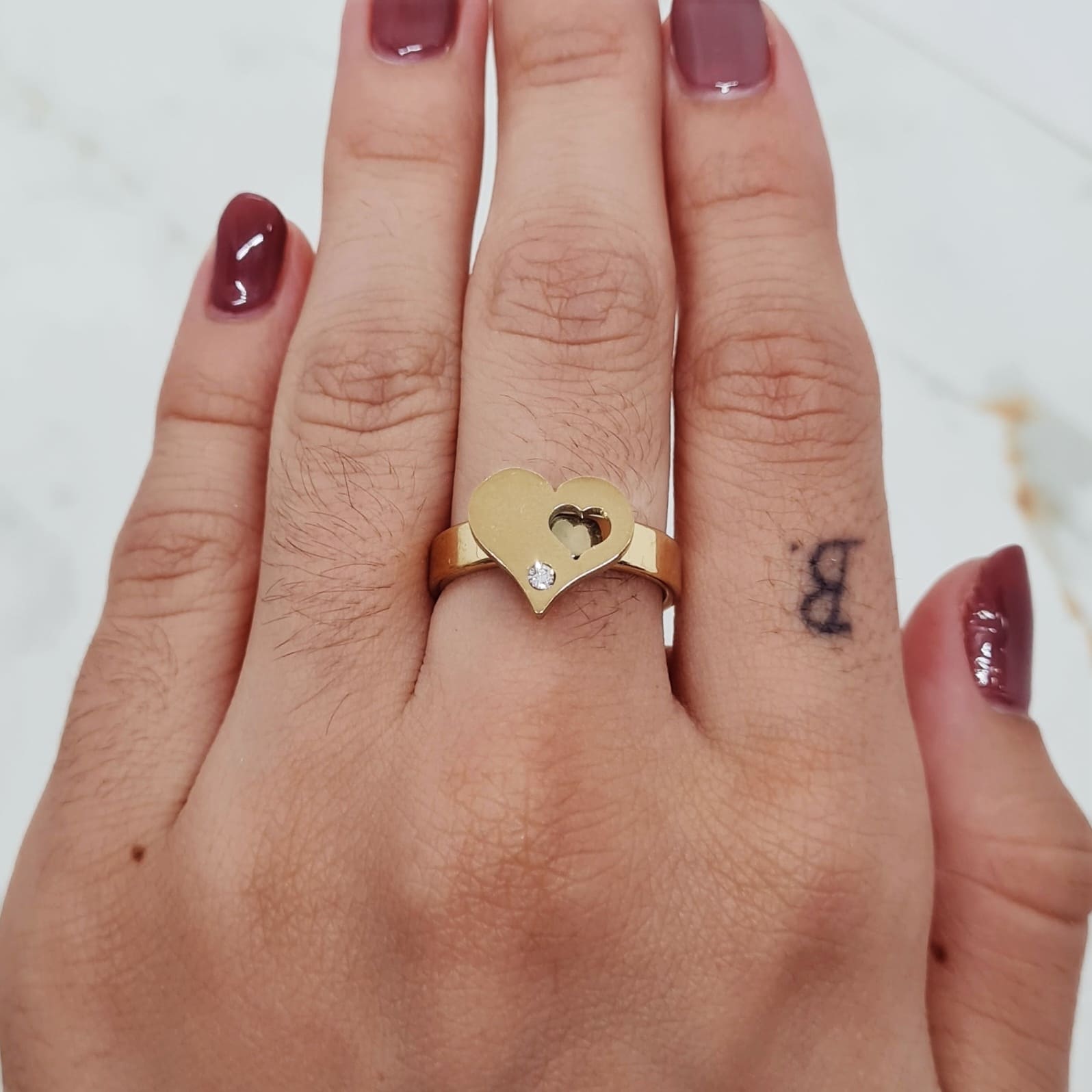 Imagen de producto ANILLO ACERO DORADO CON FORMA Y STRASS BLANCO - CORAZON