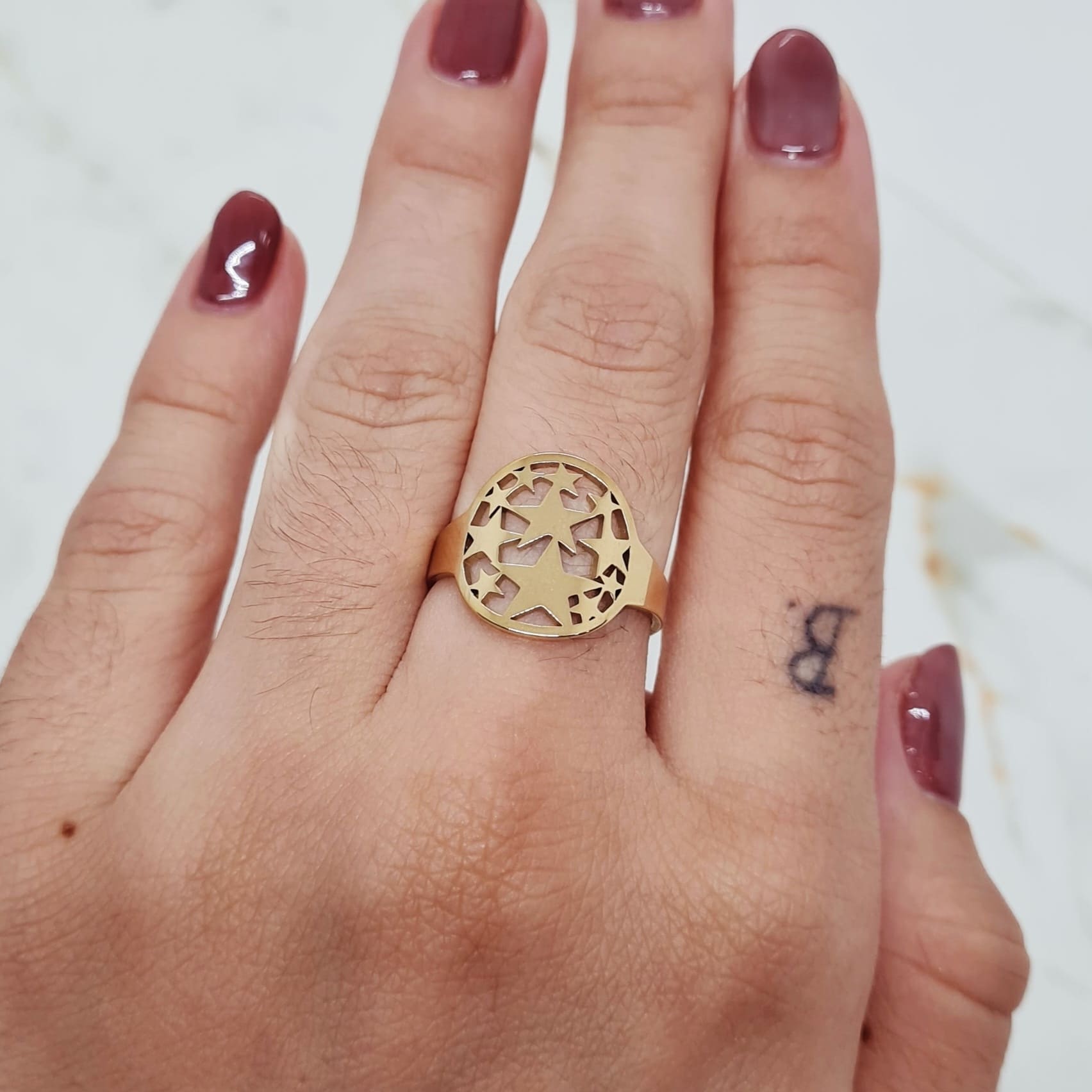 Imagen de producto ANILLO ACERO DORADO - ESTRELLAS EN CIRCULO